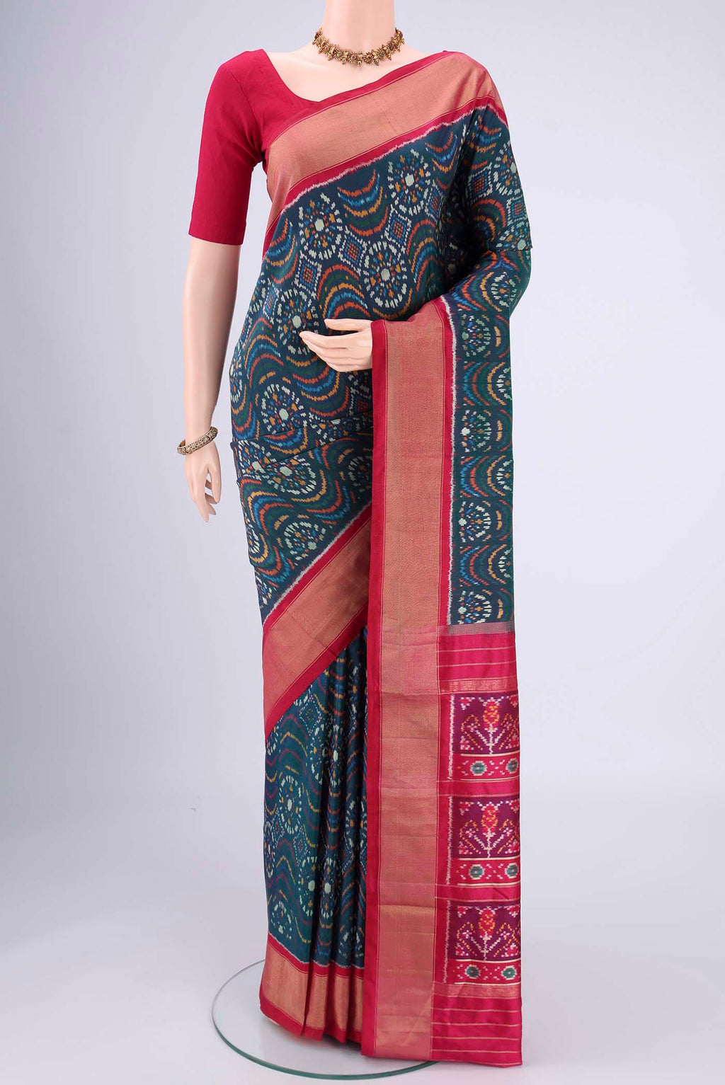 Peacock Blue Pochampally Silk Saree with Pure Ikat on the body and Zari Border.  displayed on a mannequin