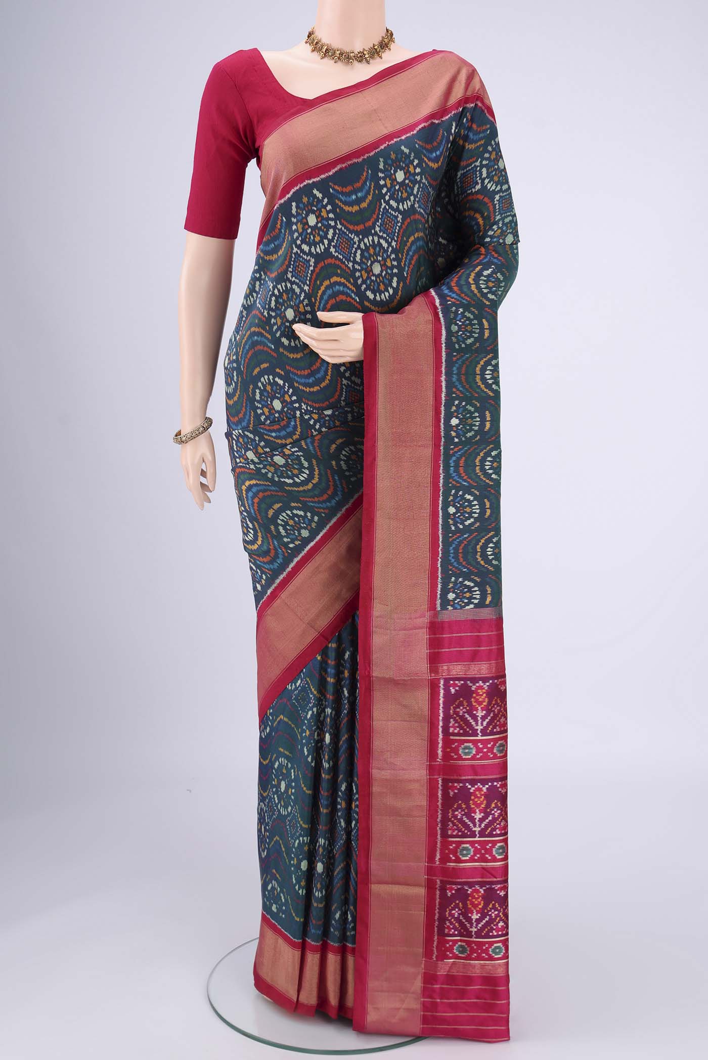 Peacock Blue Pochampally Silk Saree with Pure Ikat on the body and Zari Border.  displayed on a mannequin