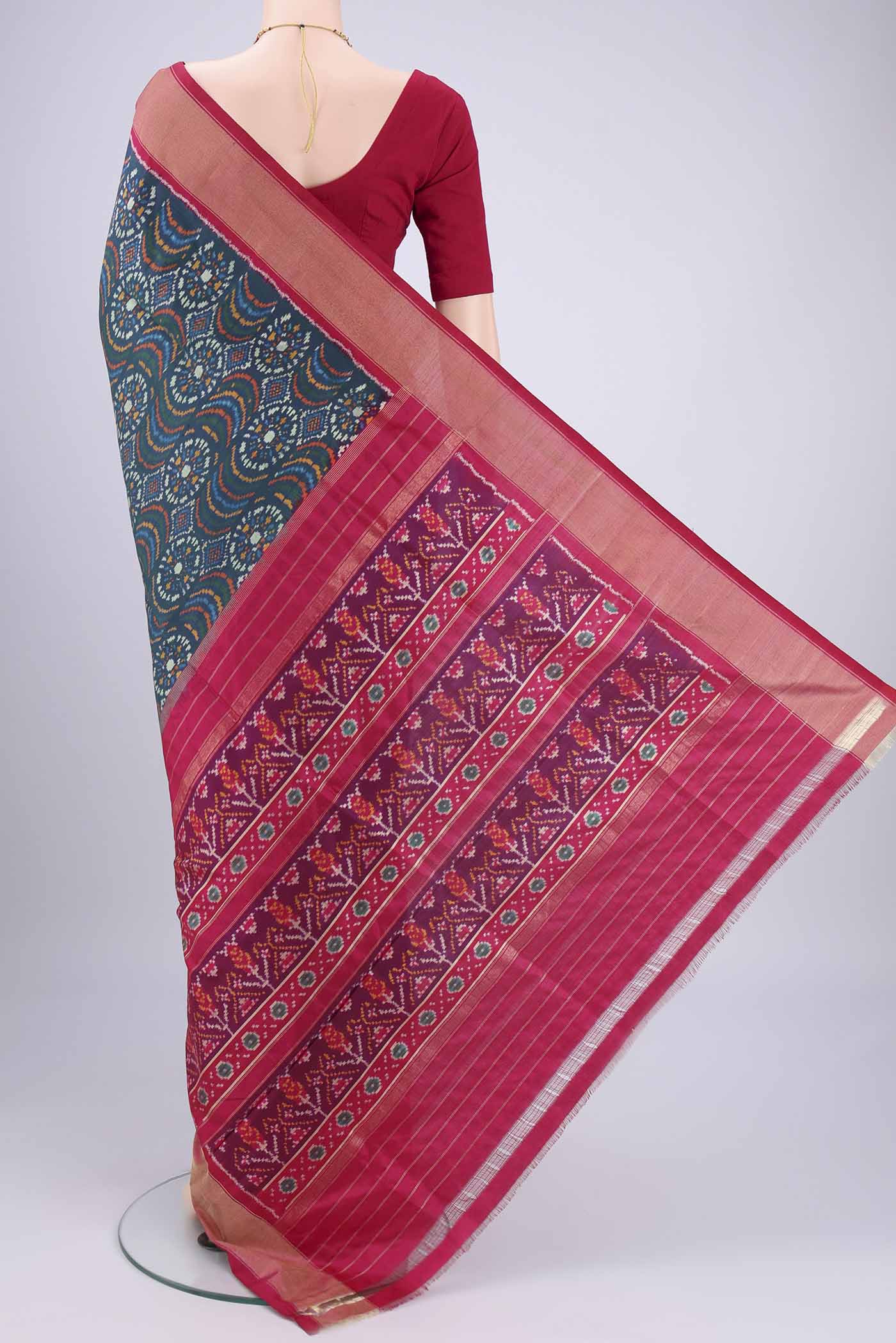 Flat view of Peacock Blue Pochampally Silk Saree with Pure Ikat on the body and Zari Border. 