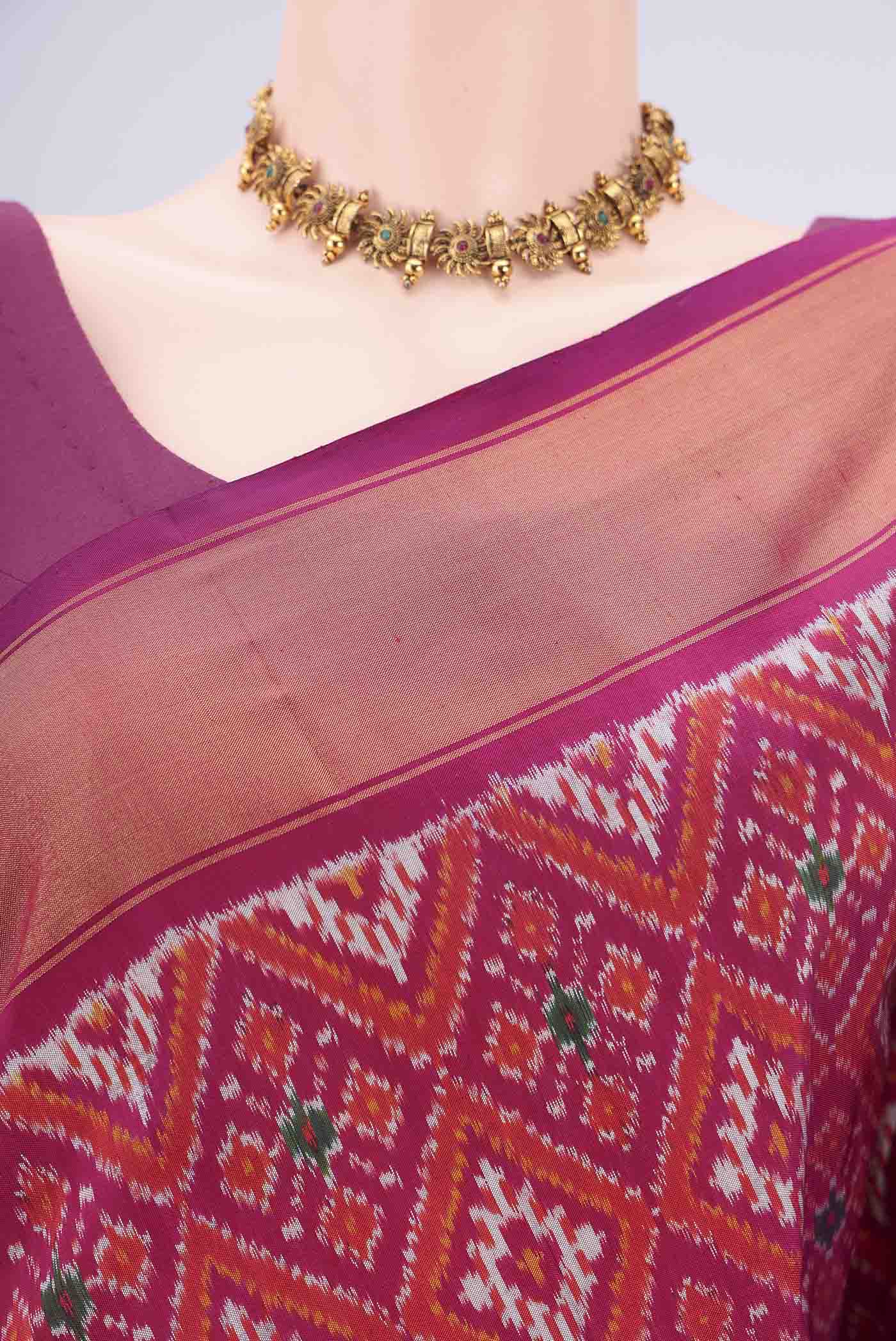 Border image of Magenta Pochampally Silk Saree with Pure Ikat on the body and Zari Border. 