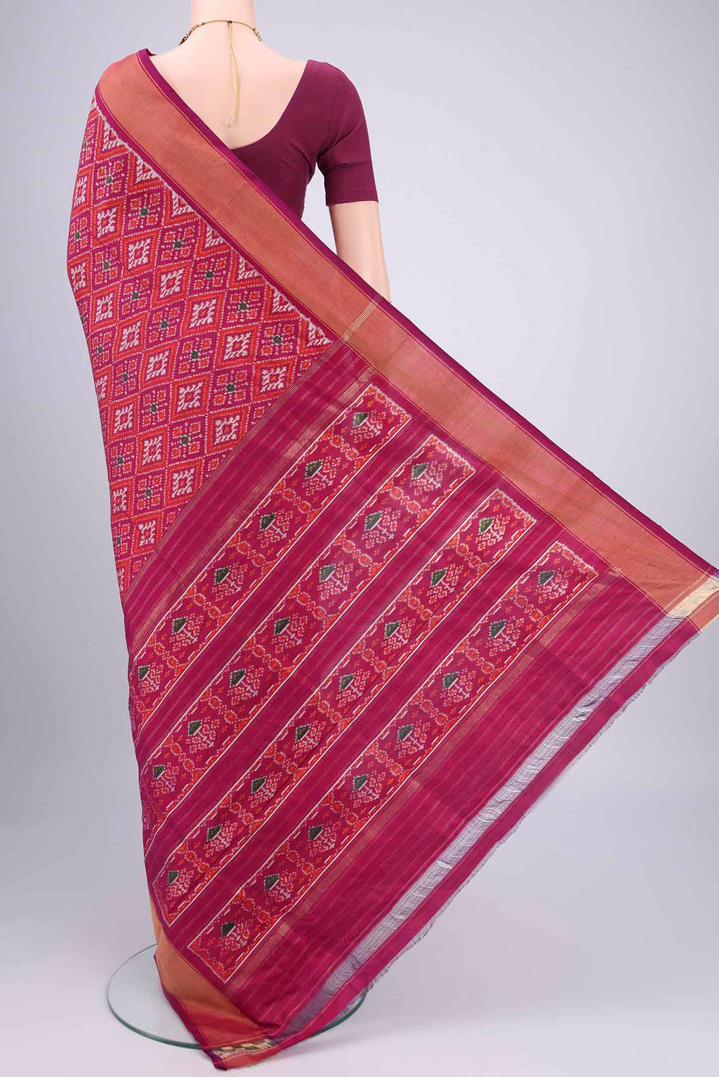 Flat view of Magenta Pochampally Silk Saree with Pure Ikat on the body and Zari Border. 
