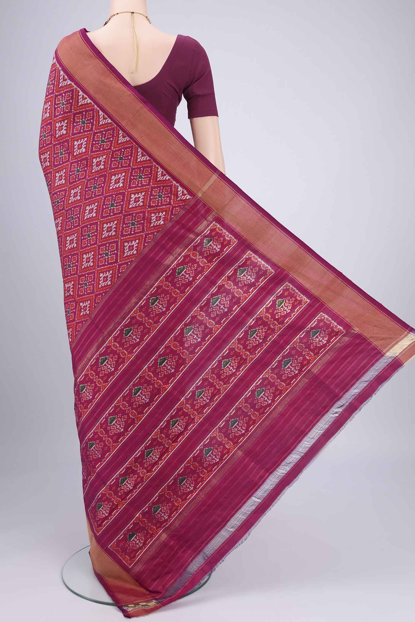 Flat view of Magenta Pochampally Silk Saree with Pure Ikat on the body and Zari Border. 