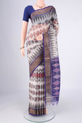 Off White Kora Cotton Saree with Ikat design on the body and Zari Border.  displayed on a mannequin