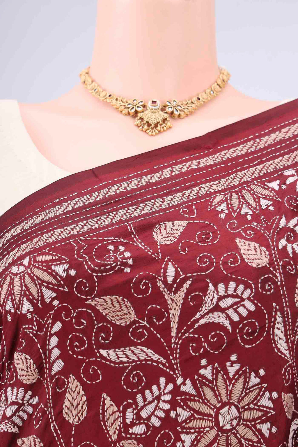 Border image of Maroon Kantha Silk Saree with Kantha Work on the body and Thread Border. 