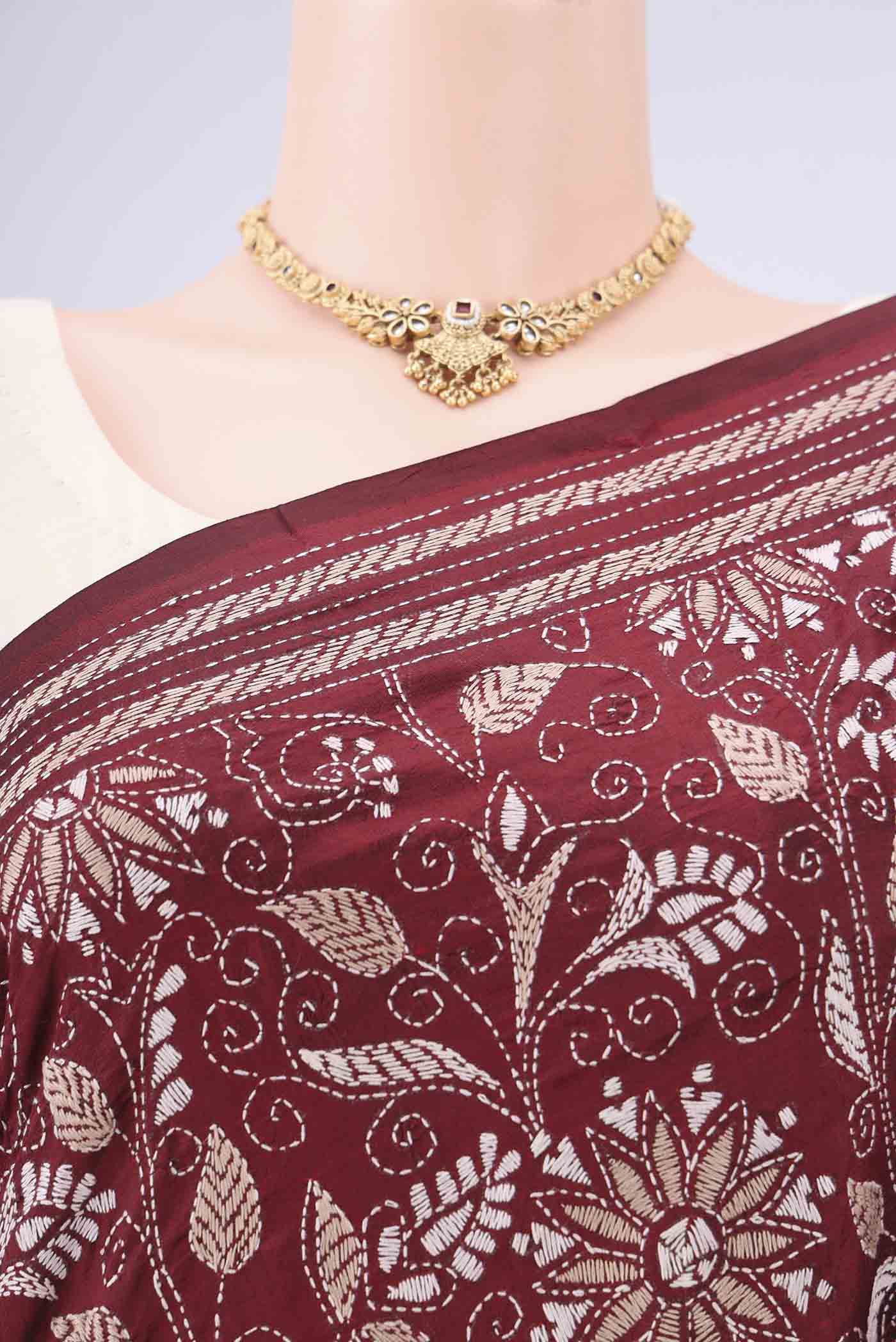 Border image of Maroon Kantha Silk Saree with Kantha Work on the body and Thread Border. 