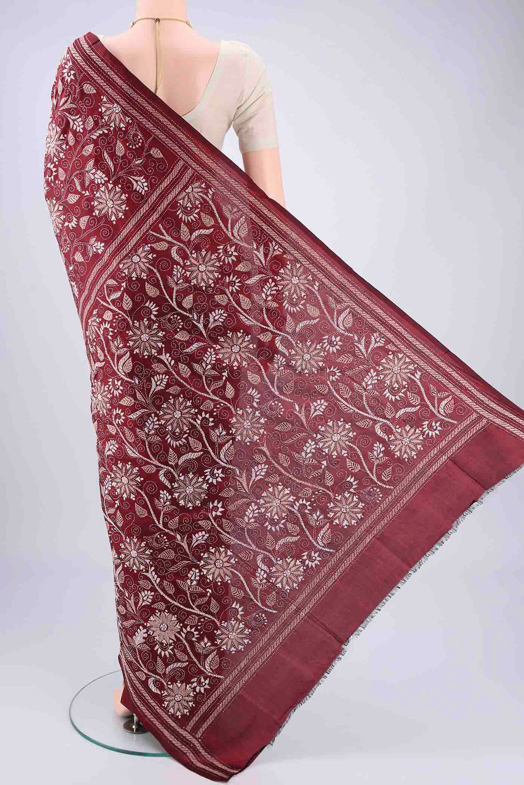 Flat view of Maroon Kantha Silk Saree with Kantha Work on the body and Thread Border. 