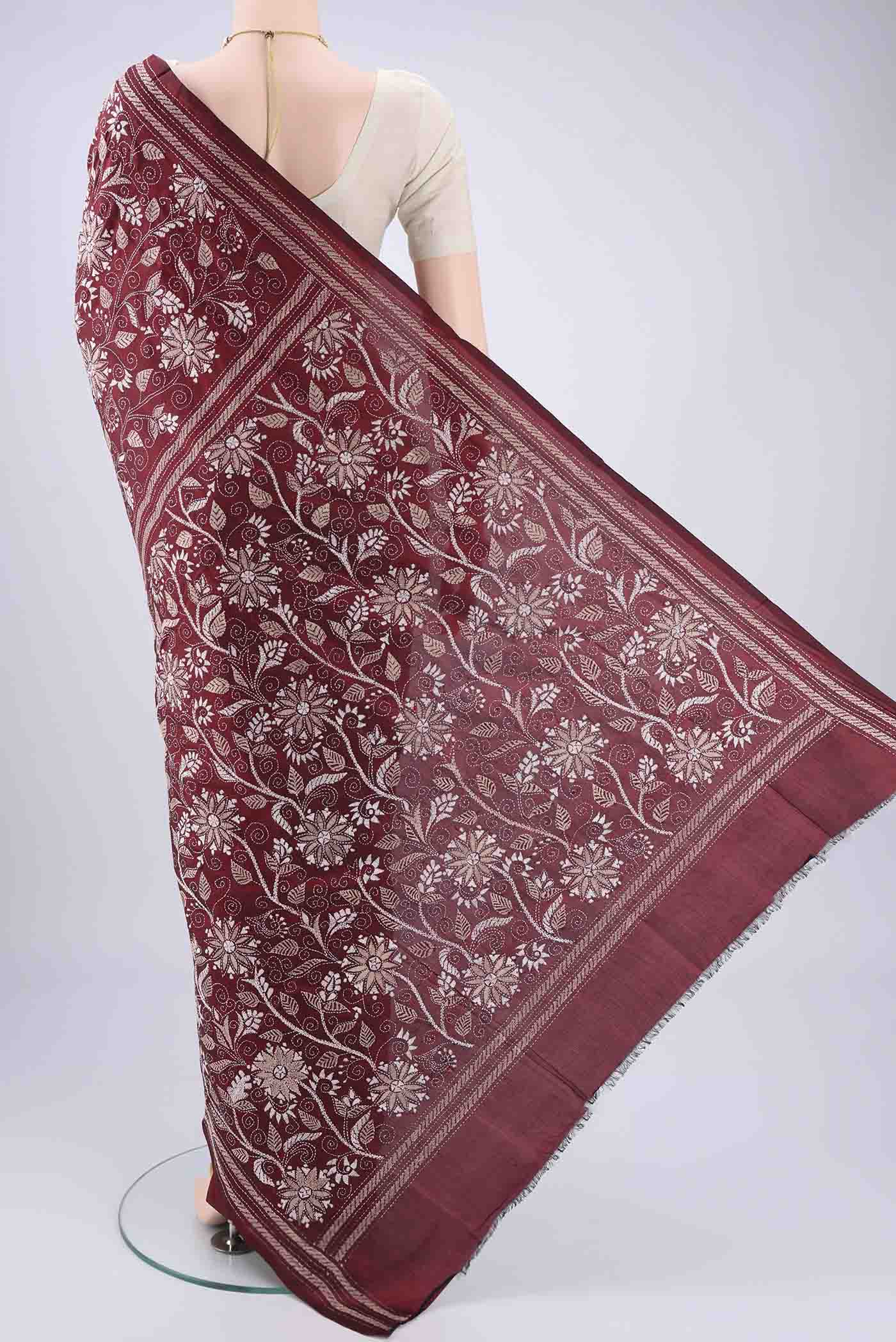 Flat view of Maroon Kantha Silk Saree with Kantha Work on the body and Thread Border. 
