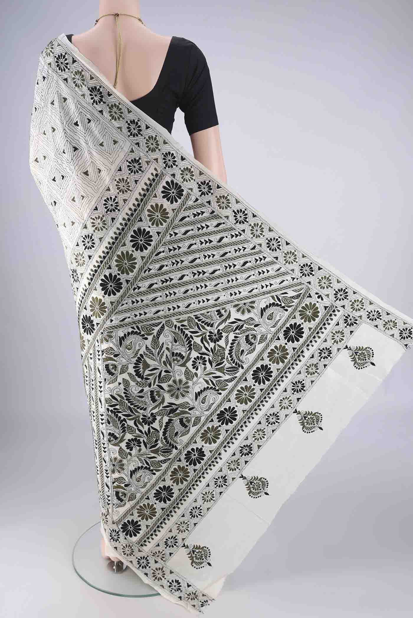 Flat view of Off White Tussar Silk Saree with Kantha Work on the body and Thread Border. 