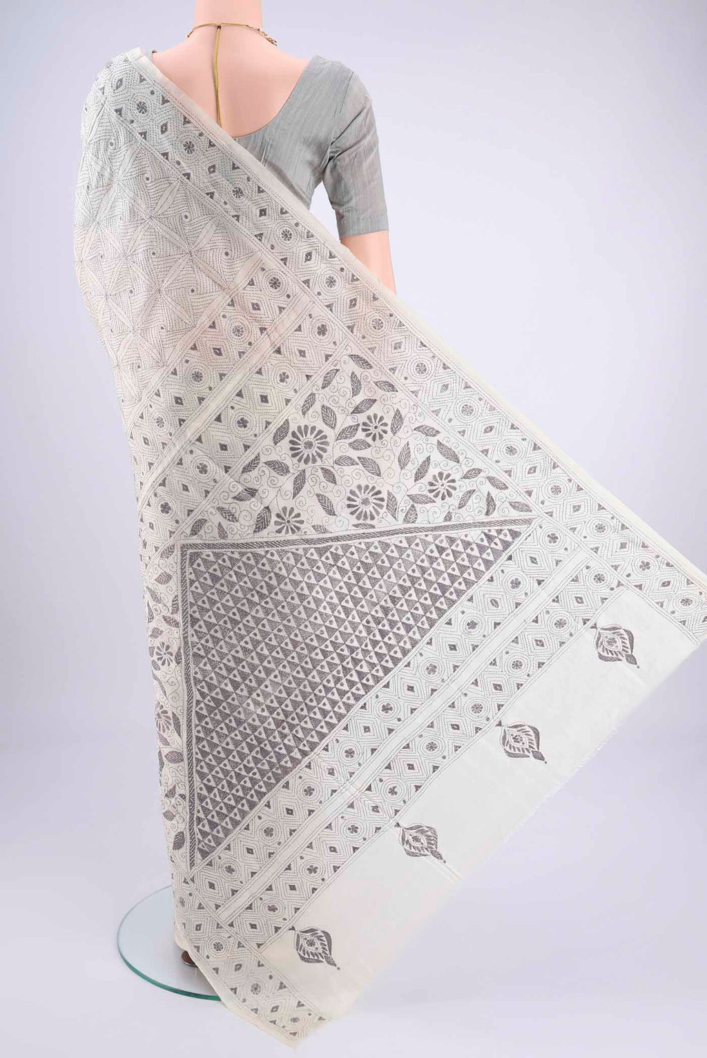Flat view of White Kantha Silk Saree with Kantha Work on the body and Thread Border. 