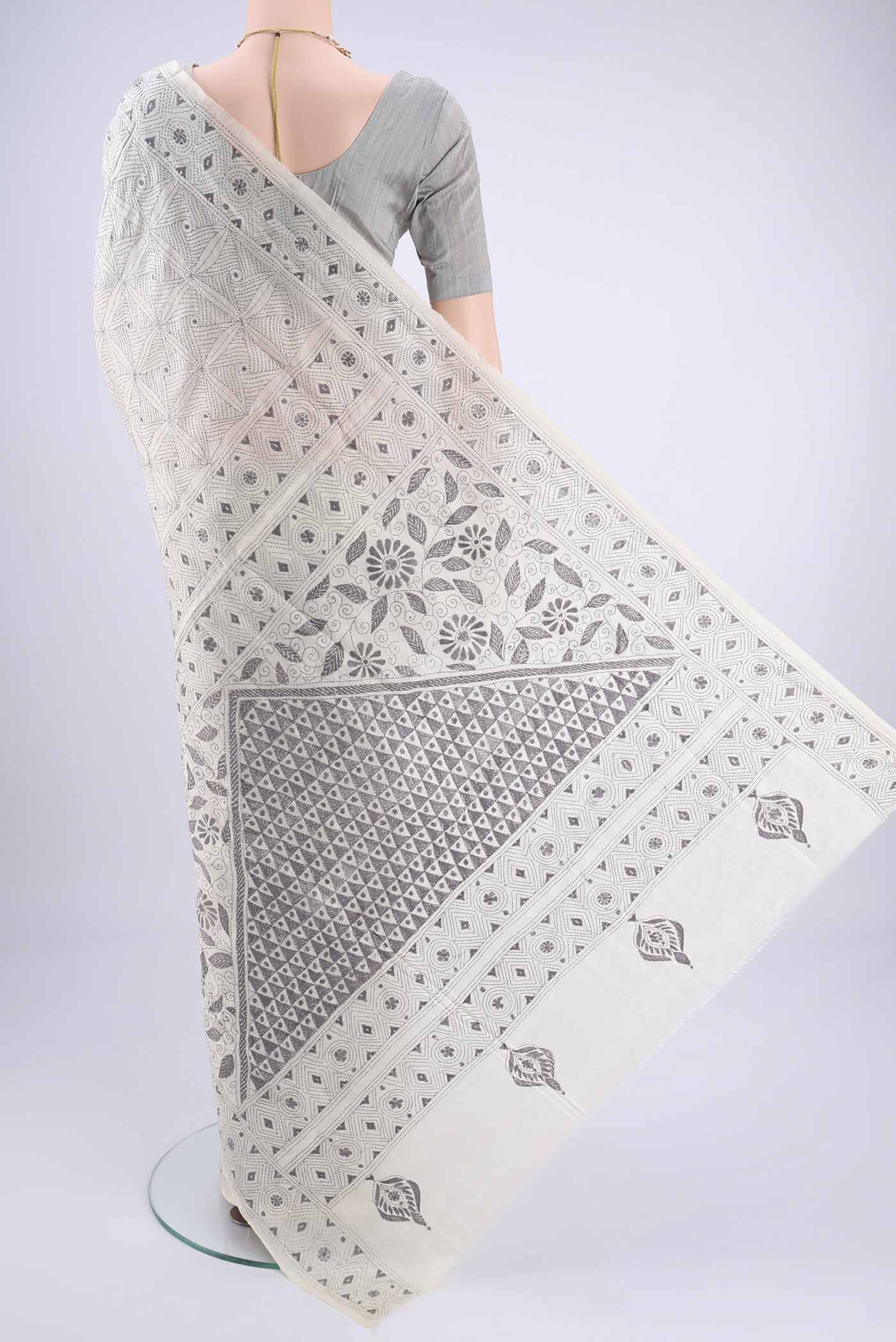 Flat view of White Kantha Silk Saree with Kantha Work on the body and Thread Border. 