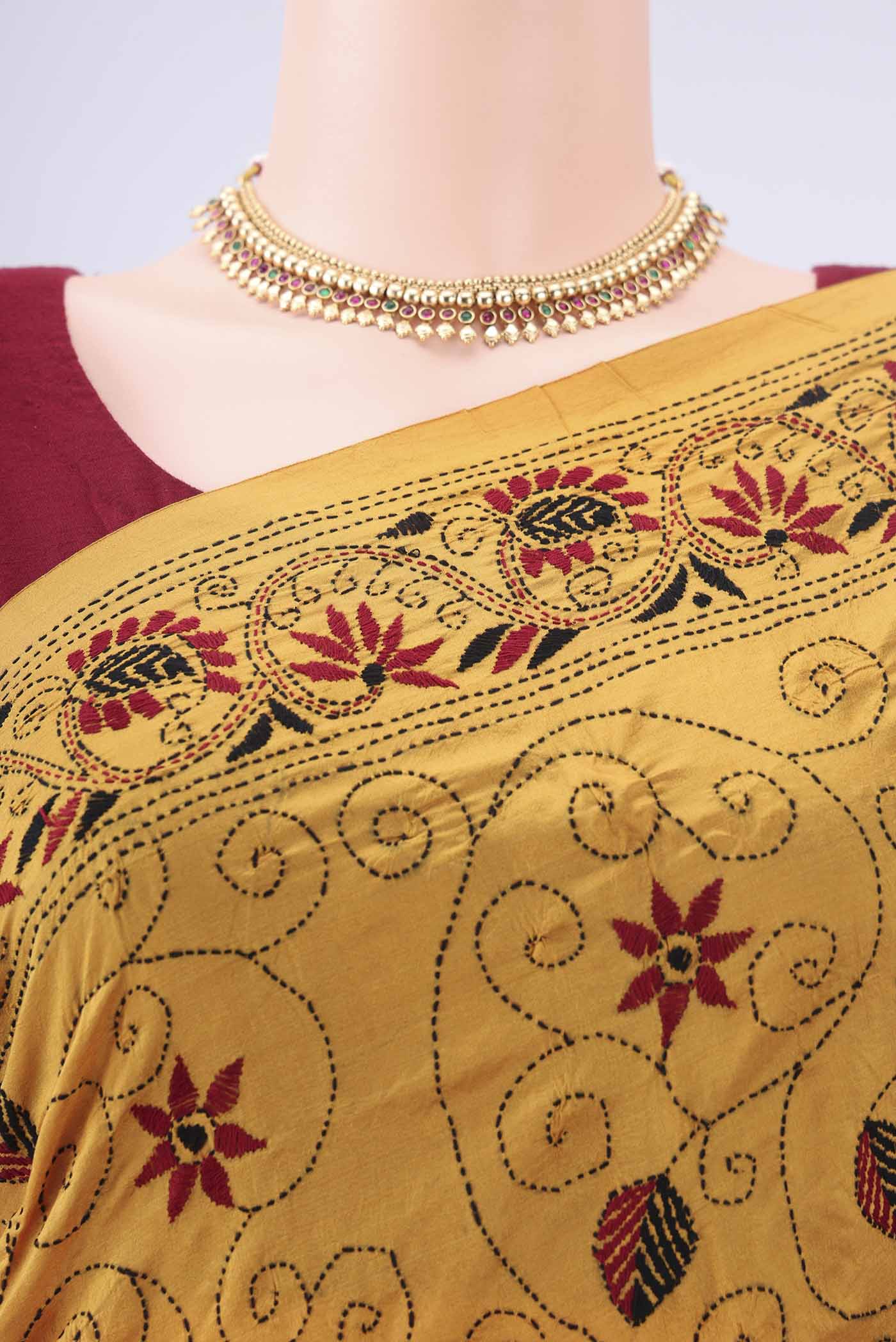 Border image of Mustard Kantha Silk Saree with Kantha Work on the body and Thread Border. 