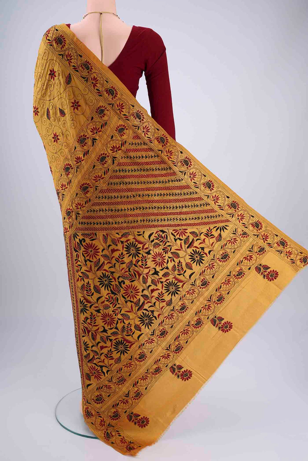 Flat view of Mustard Kantha Silk Saree with Kantha Work on the body and Thread Border. 
