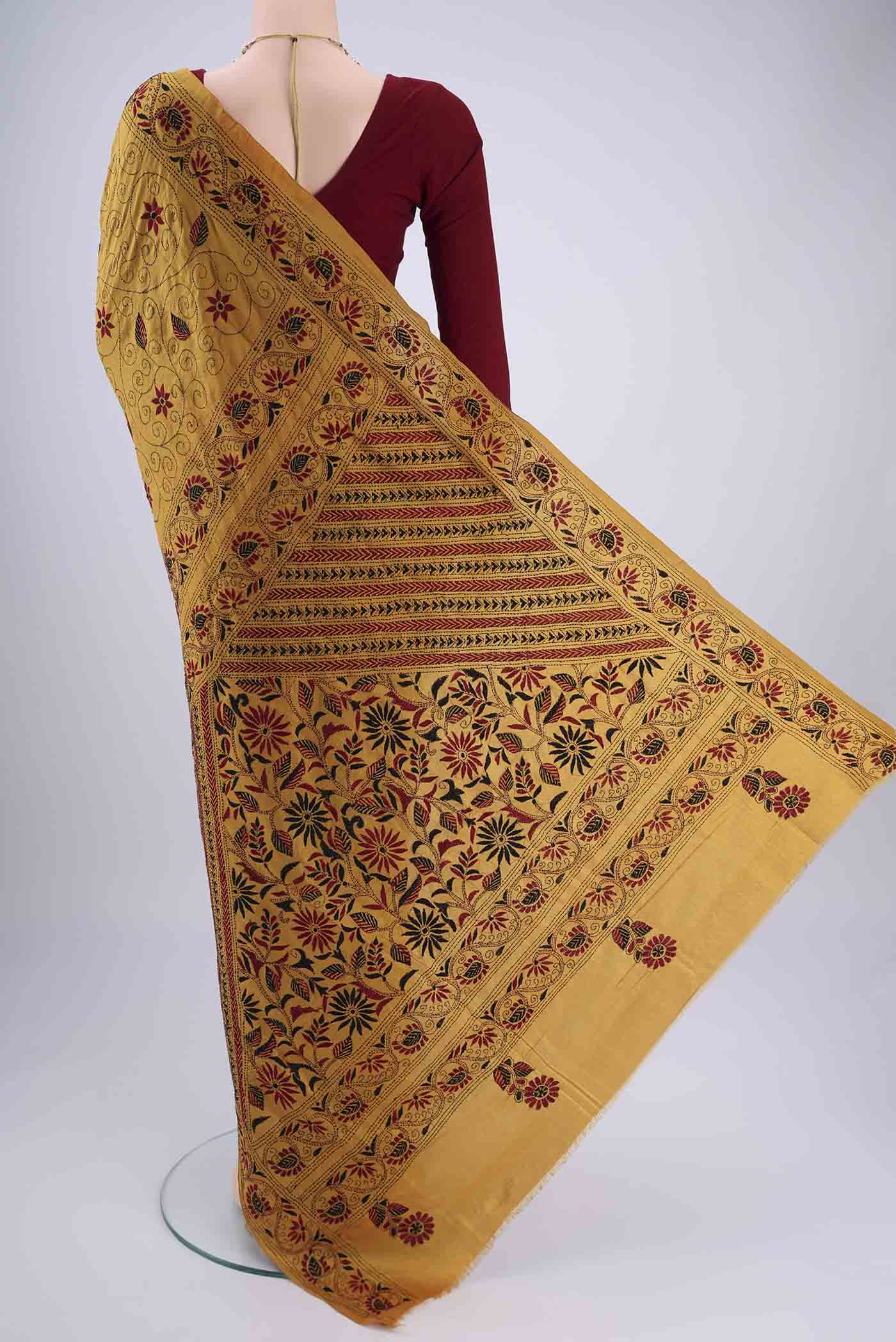 Flat view of Mustard Kantha Silk Saree with Kantha Work on the body and Thread Border. 