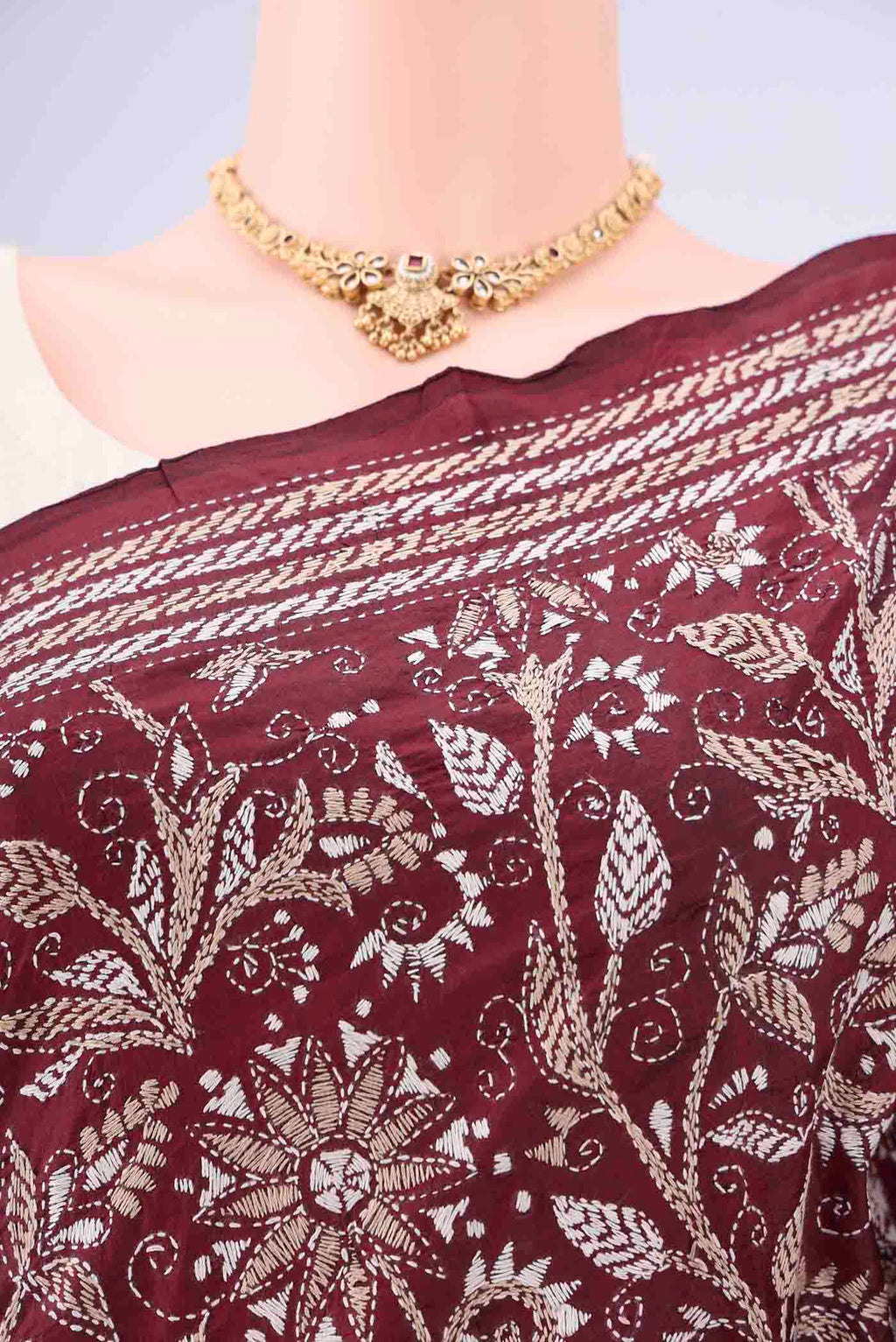 Border image of Maroon Kantha Silk Saree with Kantha Work on the body and Thread Border. 