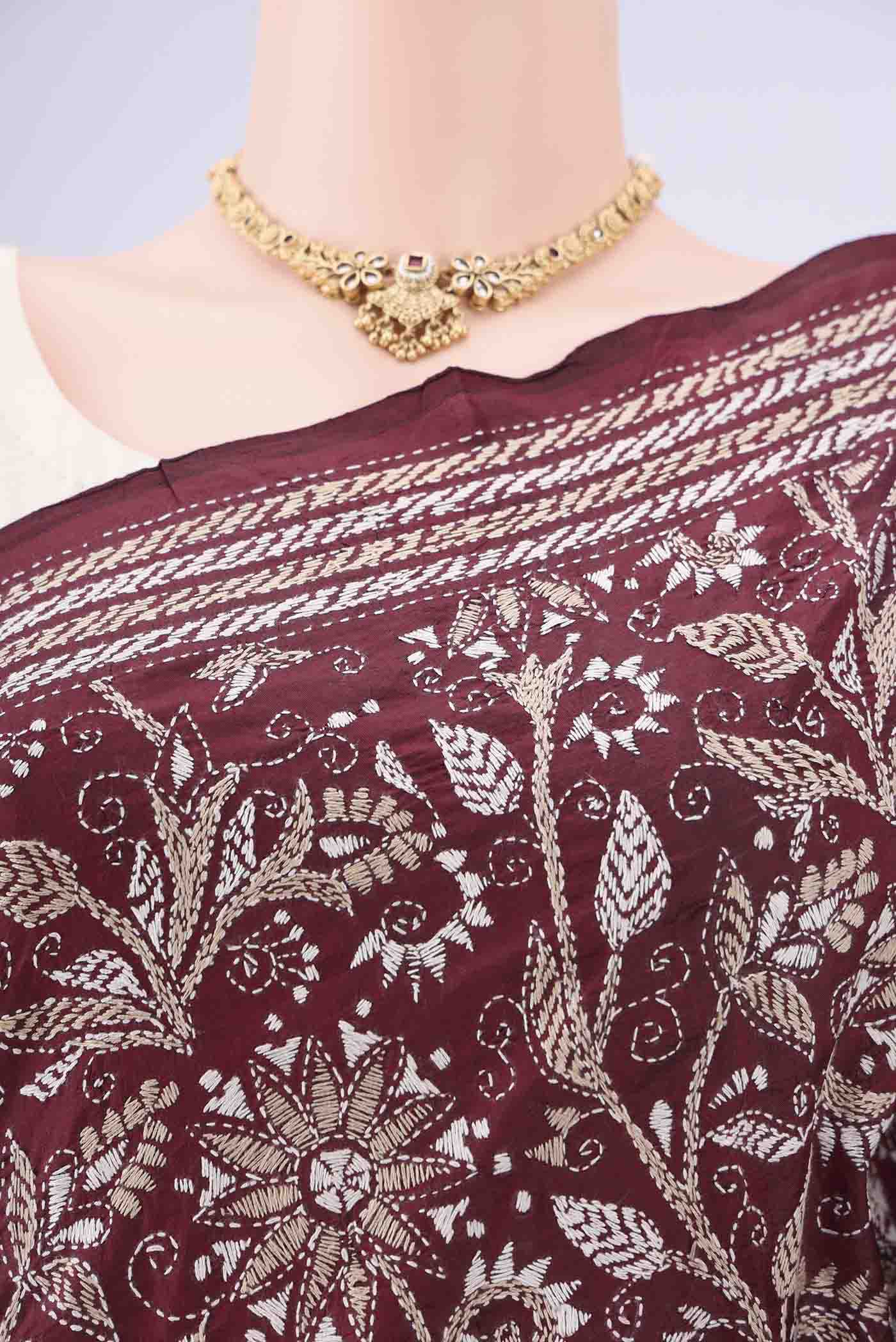 Border image of Maroon Kantha Silk Saree with Kantha Work on the body and Thread Border. 