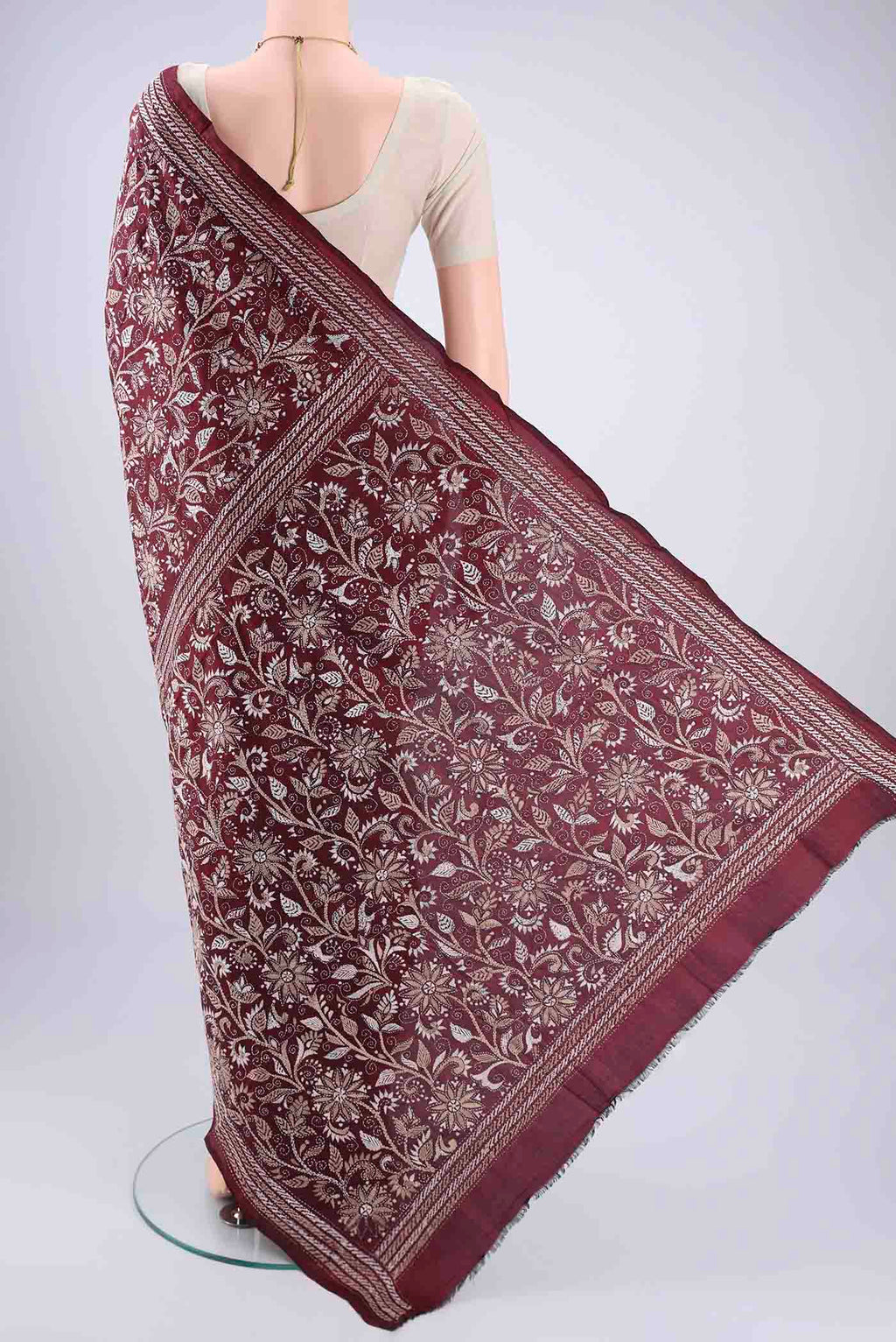 Flat view of Maroon Kantha Silk Saree with Kantha Work on the body and Thread Border. 