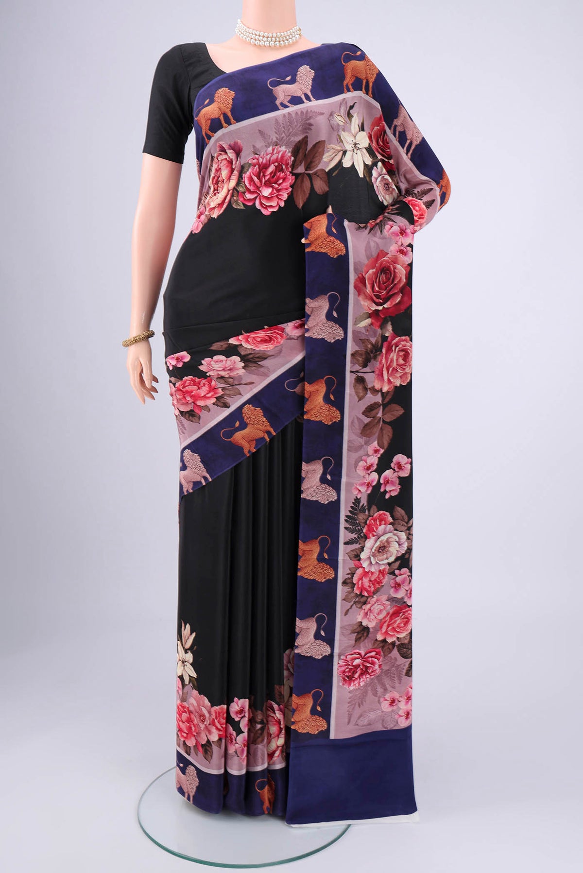 Black Mysore Crepe Saree with Floral Print on the body and Zari Border.  displayed on a mannequin