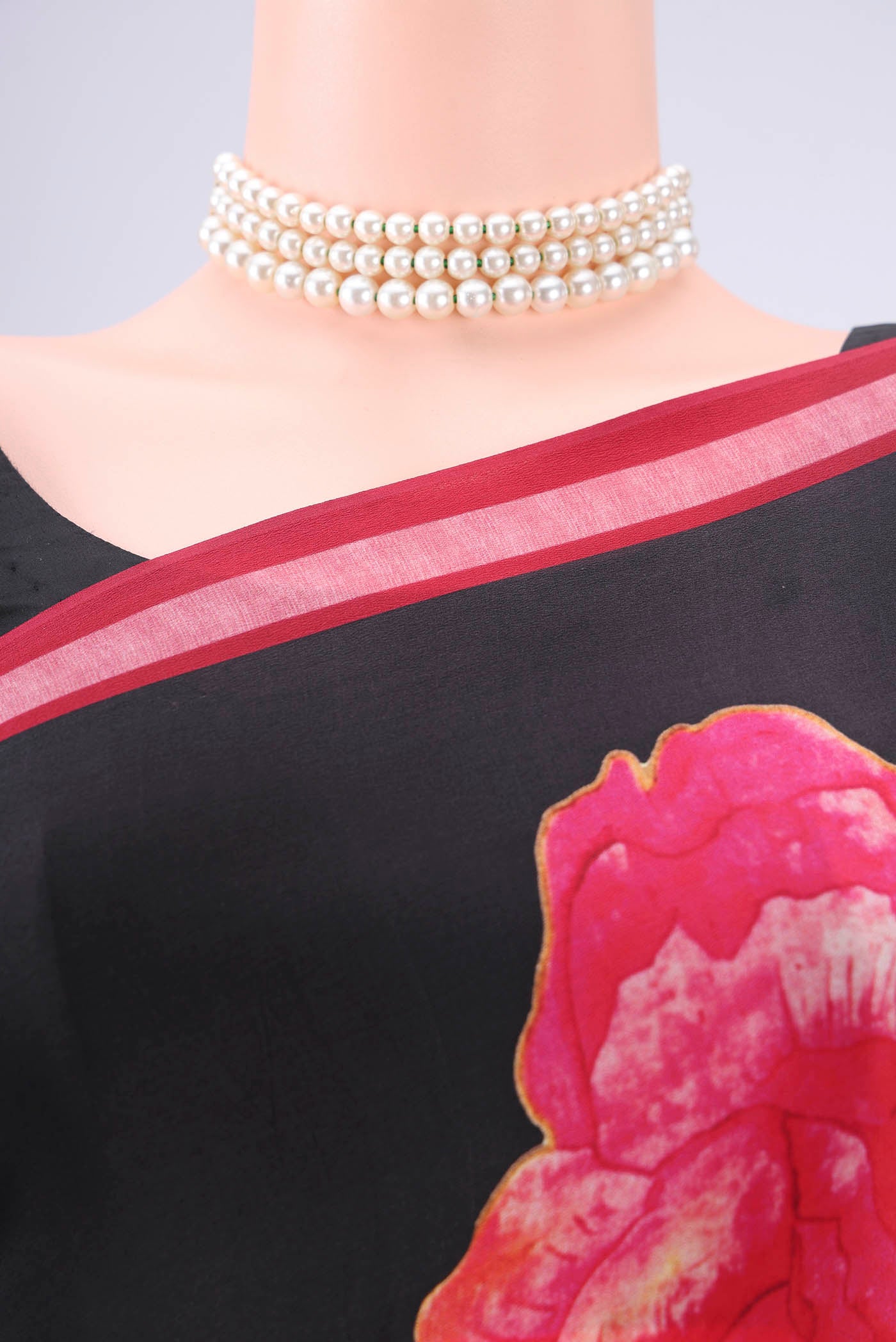 Border image of Black Mysore Crepe Saree with Floral Print on the body and Zari Border. 