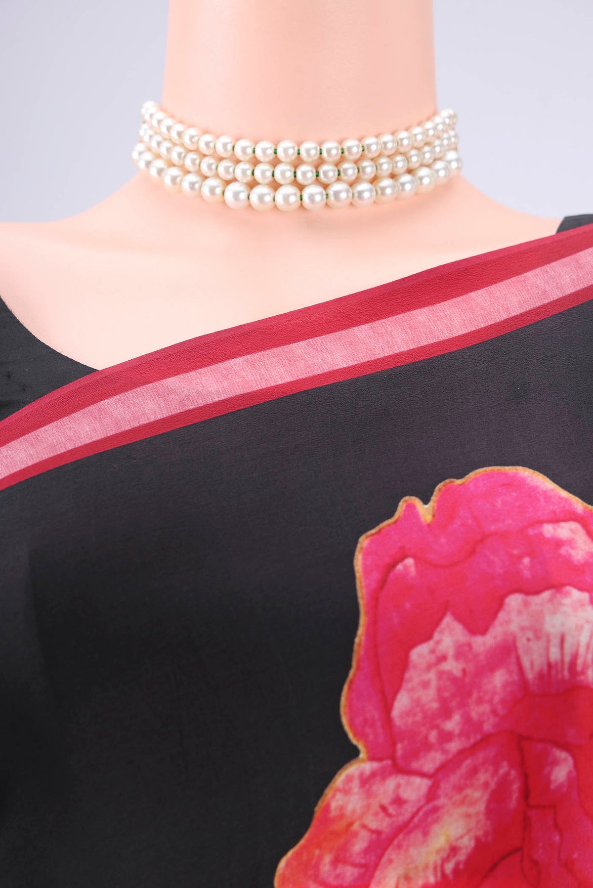 Border image of Black Mysore Crepe Saree with Floral Print on the body and Zari Border. 