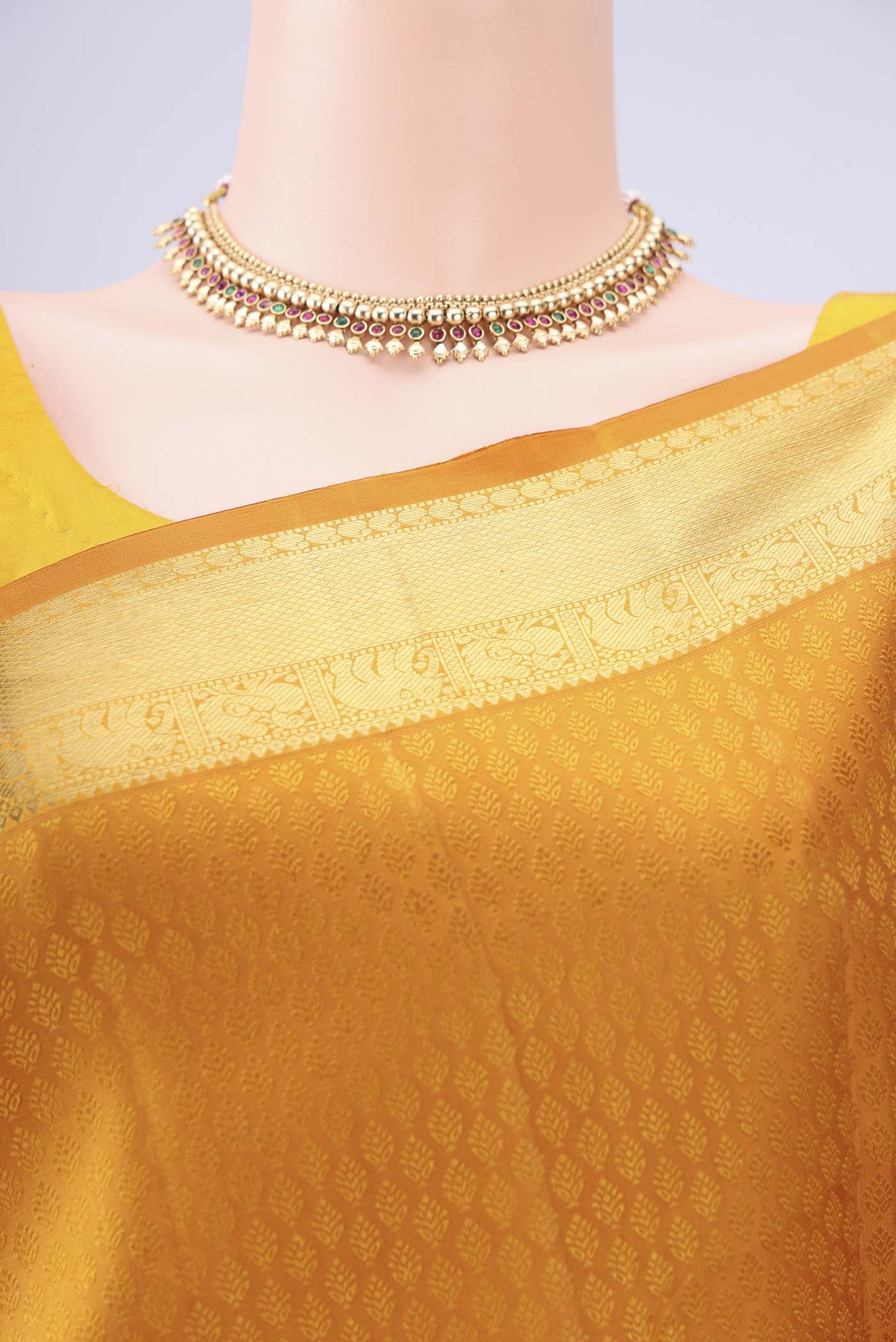 Border image of Mustard Kanjivaram Silk Saree with Jacquard design on the body and Zari Border. 
