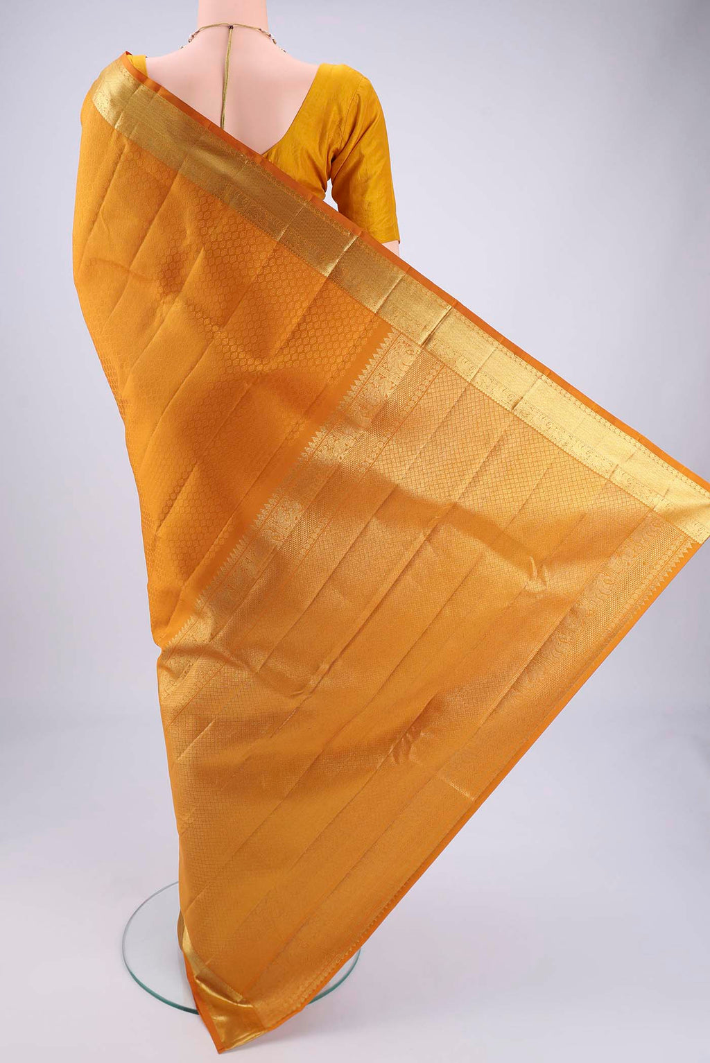 Flat view of Mustard Kanjivaram Silk Saree with Jacquard design on the body and Zari Border. 