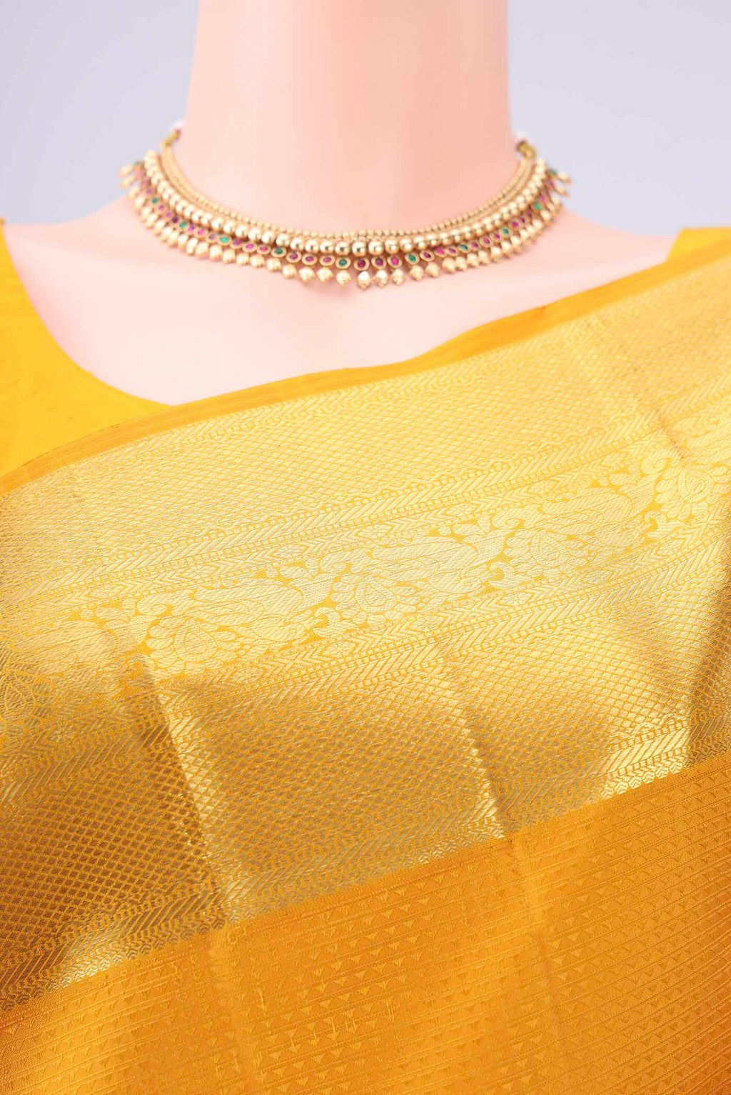 Border image of Mustard Kanjivaram Silk Saree with Jacquard design on the body and Zari Border. 
