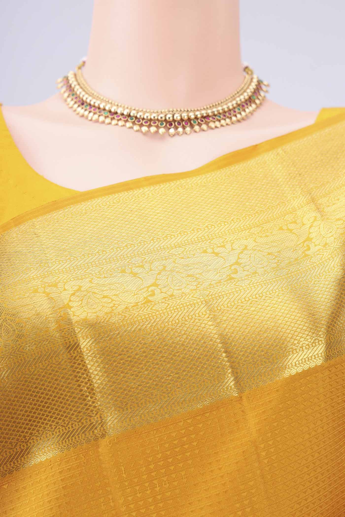 Border image of Mustard Kanjivaram Silk Saree with Jacquard design on the body and Zari Border. 