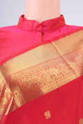 Red Dual Tone Kanchipuram Saree with Zari Butta on the body and Zari Border.  displayed on a mannequin