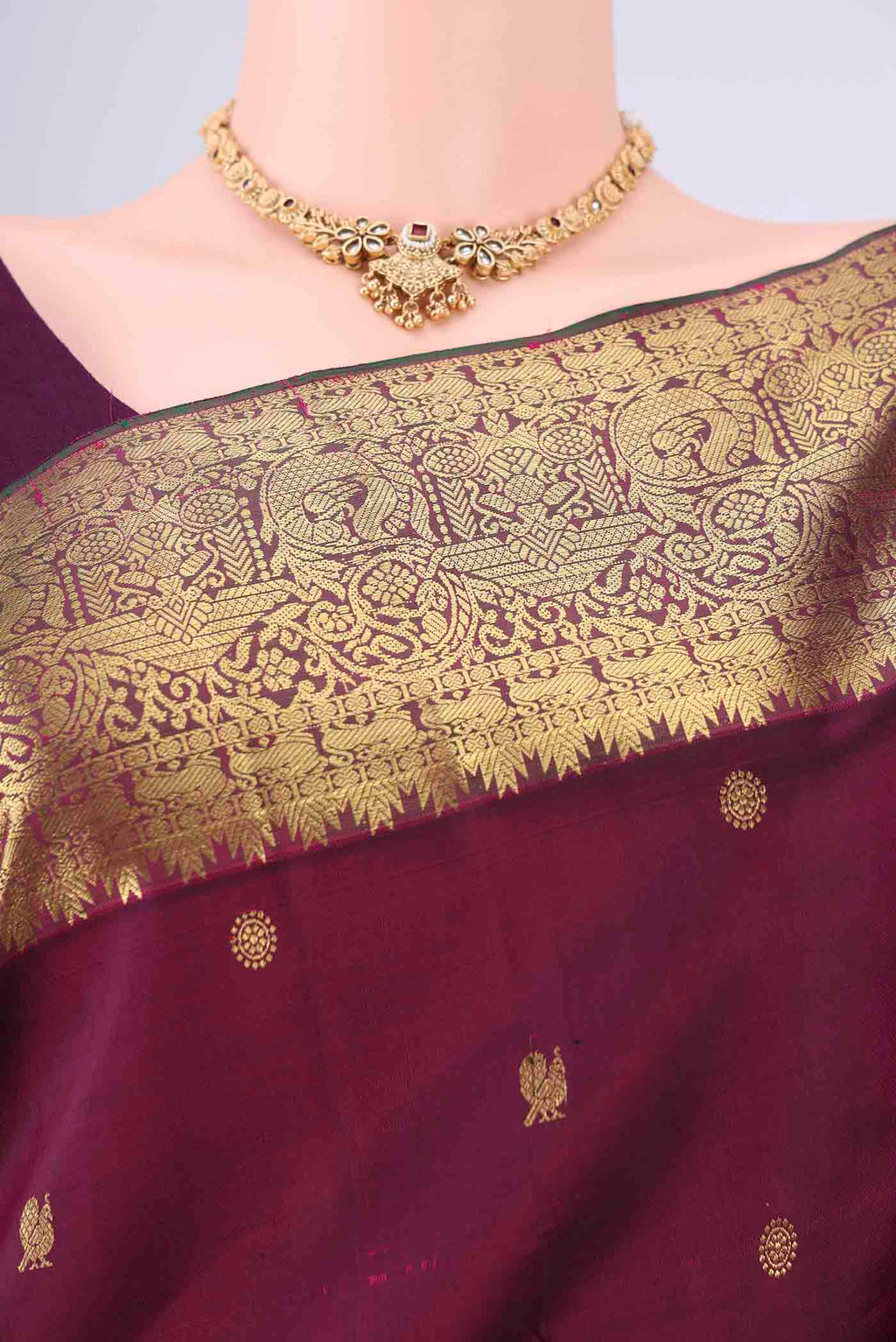 Border image of Pure Silk Pure Zari Maroon Kanchipuram Saree with Zari Butta on the body and Zari Border. 