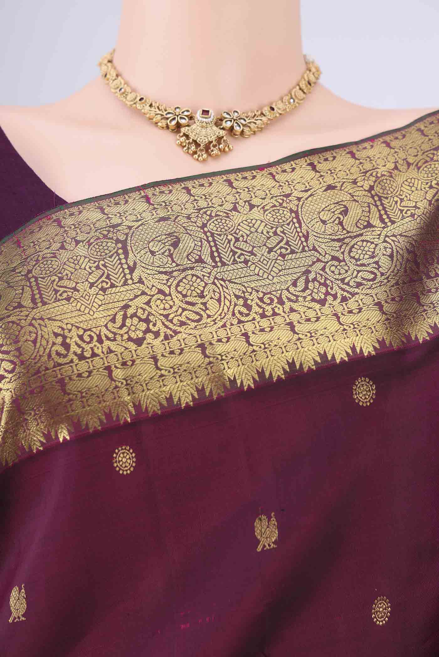 Border image of Pure Silk Pure Zari Maroon Kanchipuram Saree with Zari Butta on the body and Zari Border. 