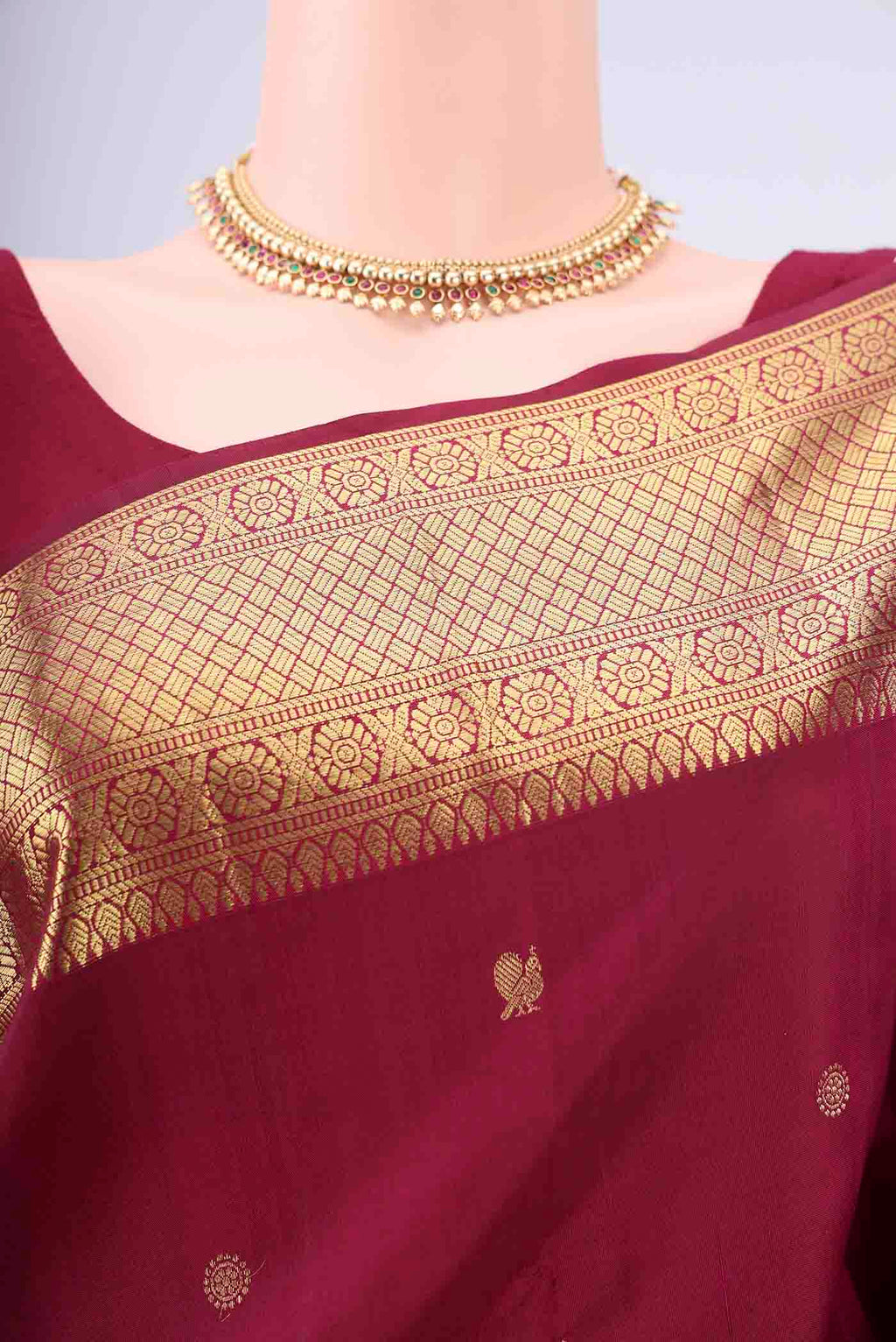 Border image of Maroon Kanchipuram Silk Saree with Zari Butta on the body and Zari Border. 
