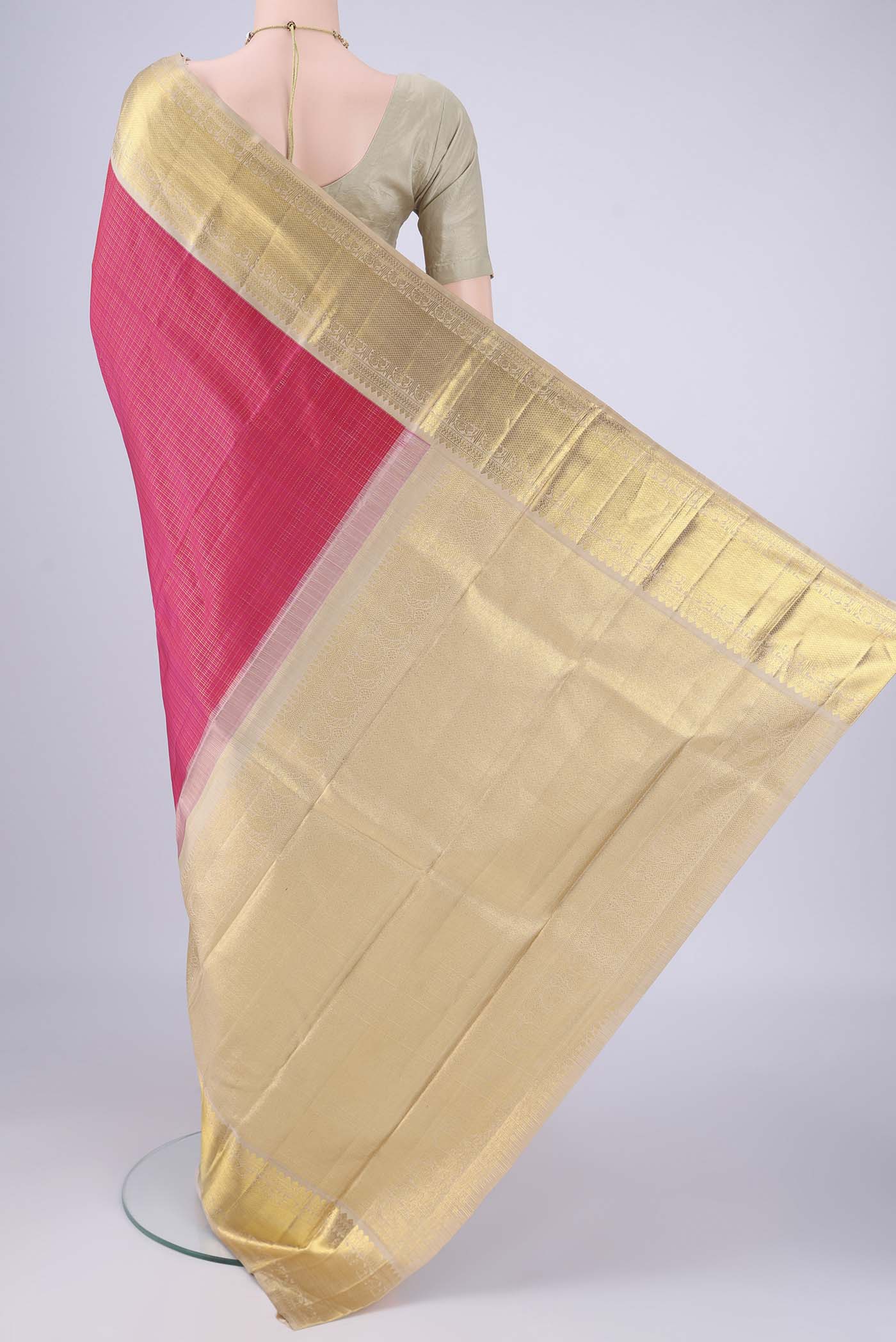 Flat view of Rani Pink Kanchipuram Silk Saree with Checked design on the body and Zari Border. 