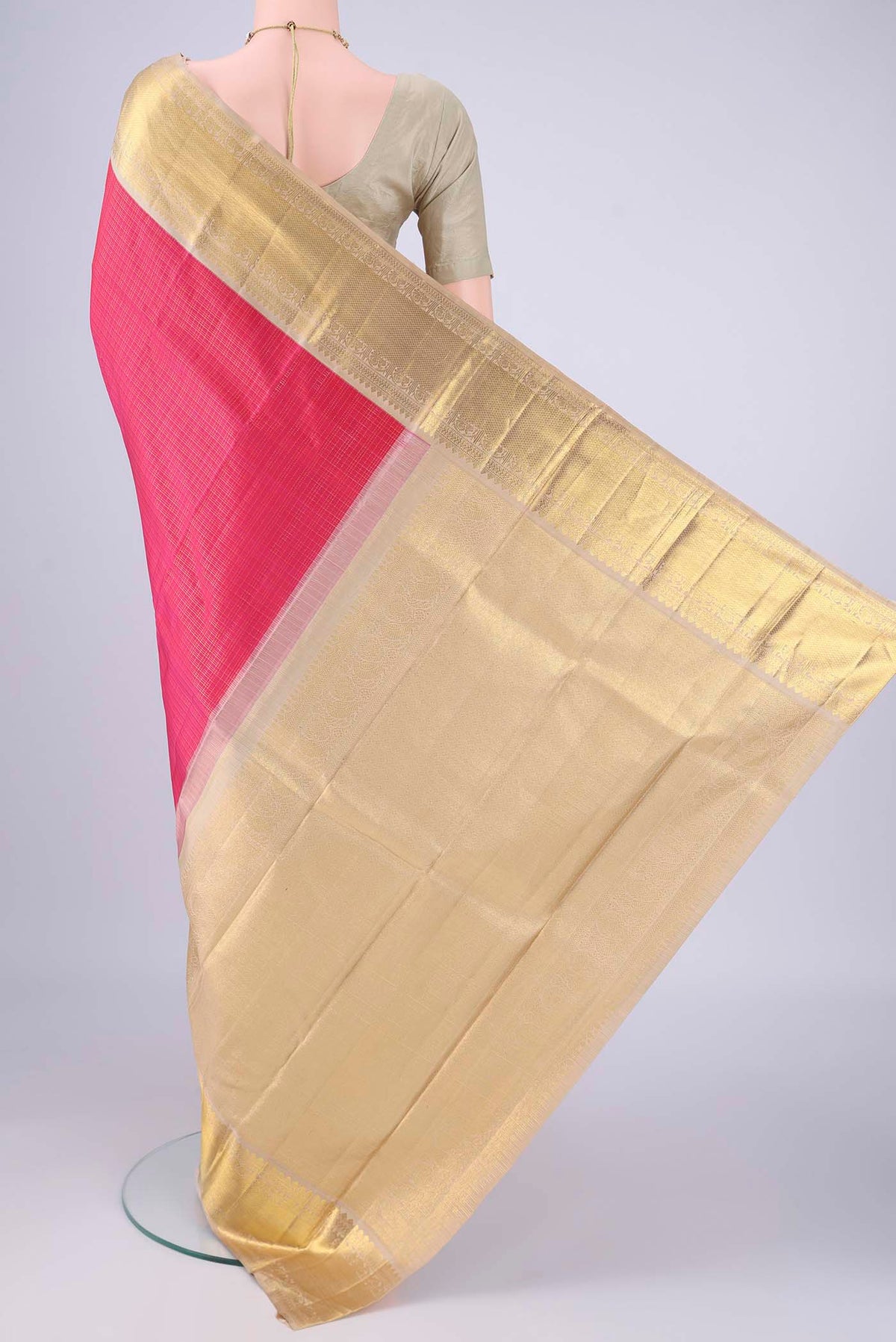 Flat view of Rani Pink Kanchipuram Silk Saree with Checked design on the body and Zari Border. 
