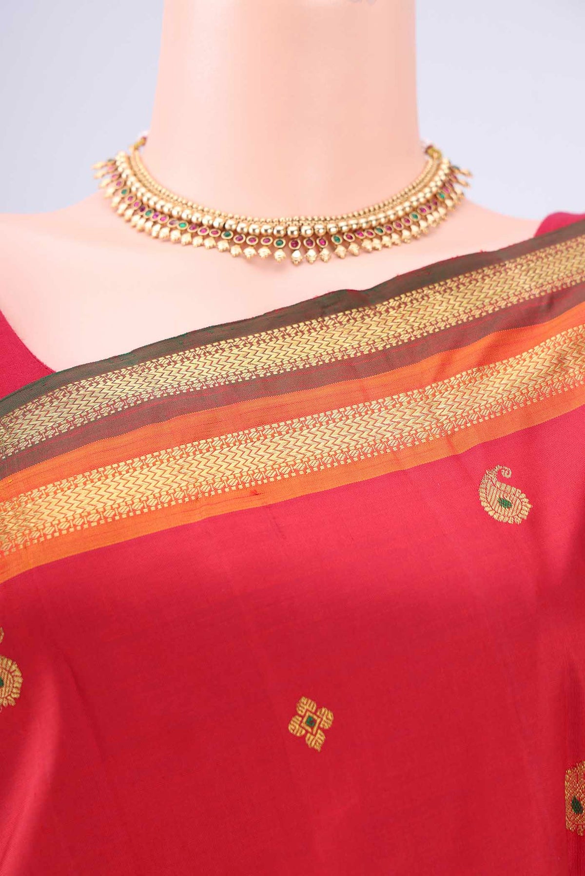 Border image of Red Kanjivaram Silk Saree with Zari Butta on the body and Zari Border. 