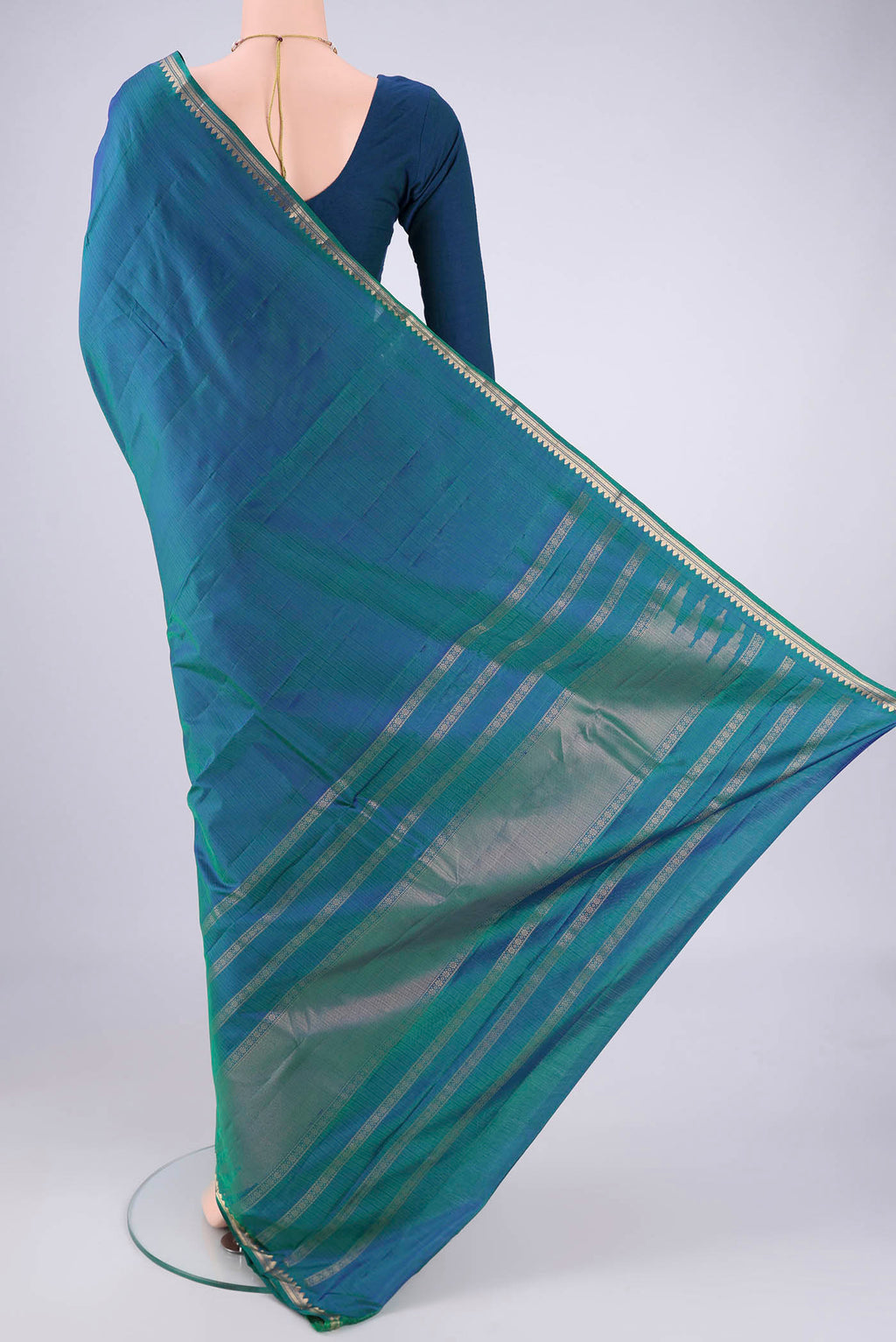 Flat view of Blue Dual Tone Kanjivaram Silk Saree with Plain Body and Zari Border. 