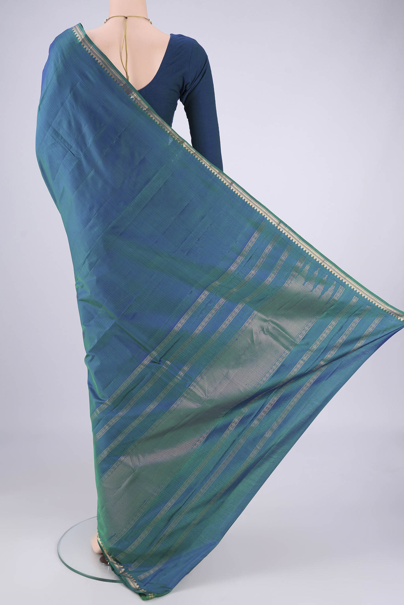 Flat view of Blue Dual Tone Kanjivaram Silk Saree with Plain Body and Zari Border. 