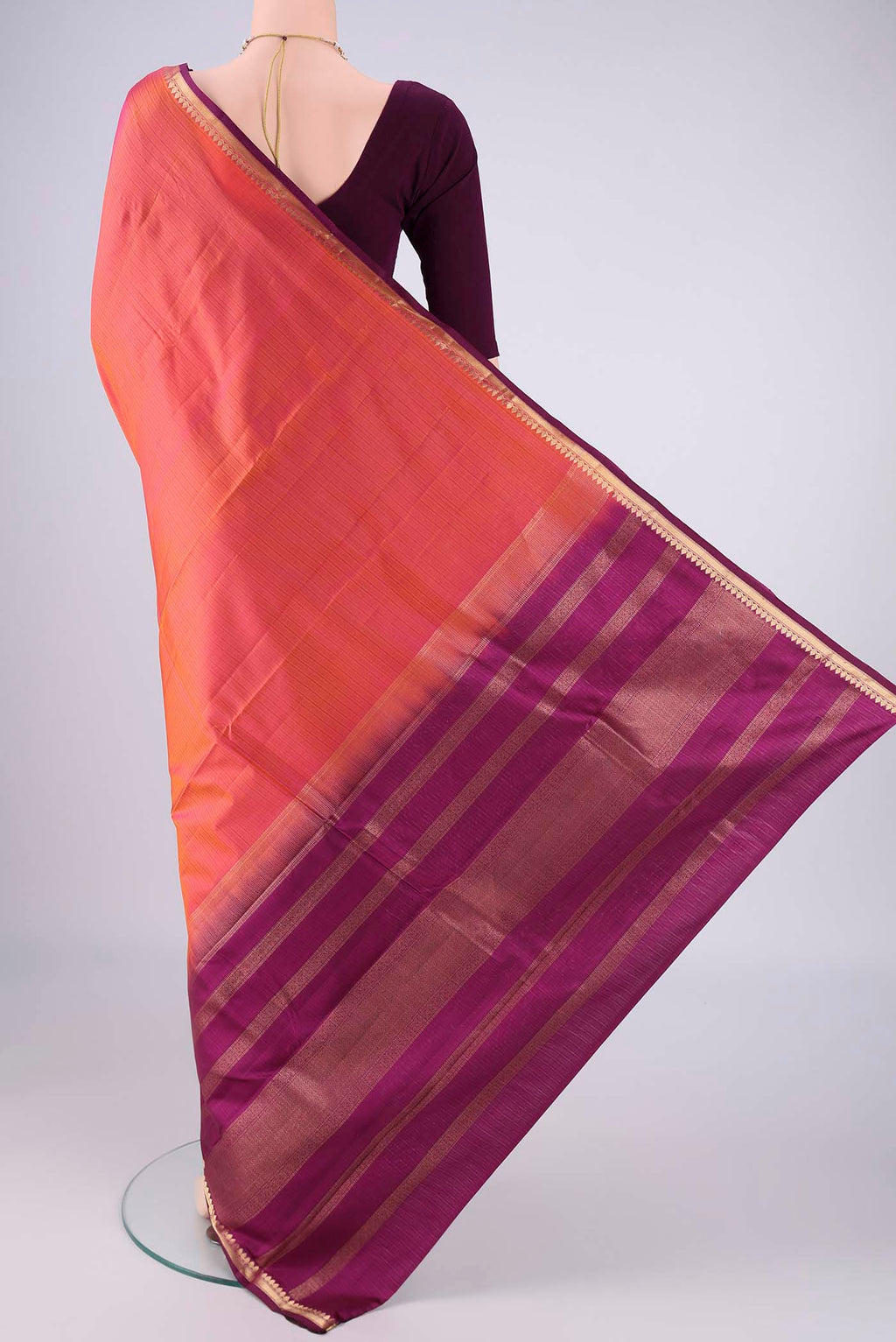 Flat view of Coral Dual Tone Kanjivaram Silk Saree with Stripes on the body and Zari Border. 
