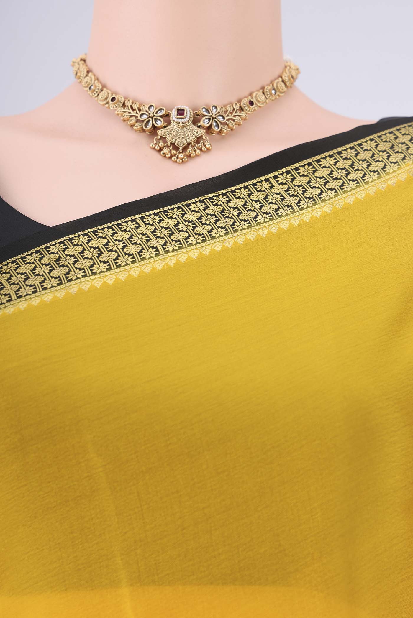 Border image of Yellow Mysore Georgette Saree with Plain Body and Zari Border. 