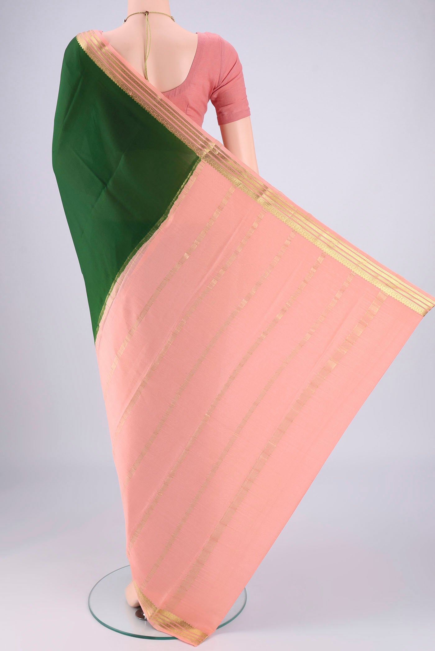 Flat view of Bottle Green Mysore Georgette Saree with Zari Butta on the body and Zari Border. 