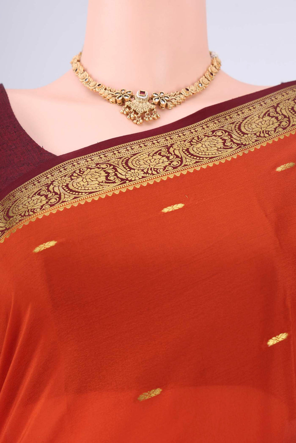 Border image of Rust Mysore Georgette Saree with Zari Butta on the body and Zari Border. 
