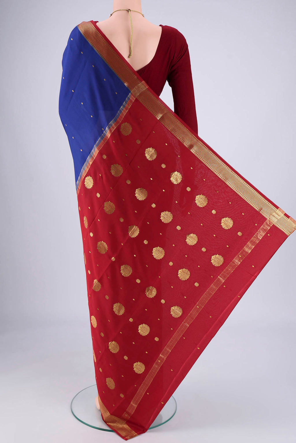 Flat view of Royal Blue Mysore Georgette Saree with Zari Butta on the body and Zari Border. 