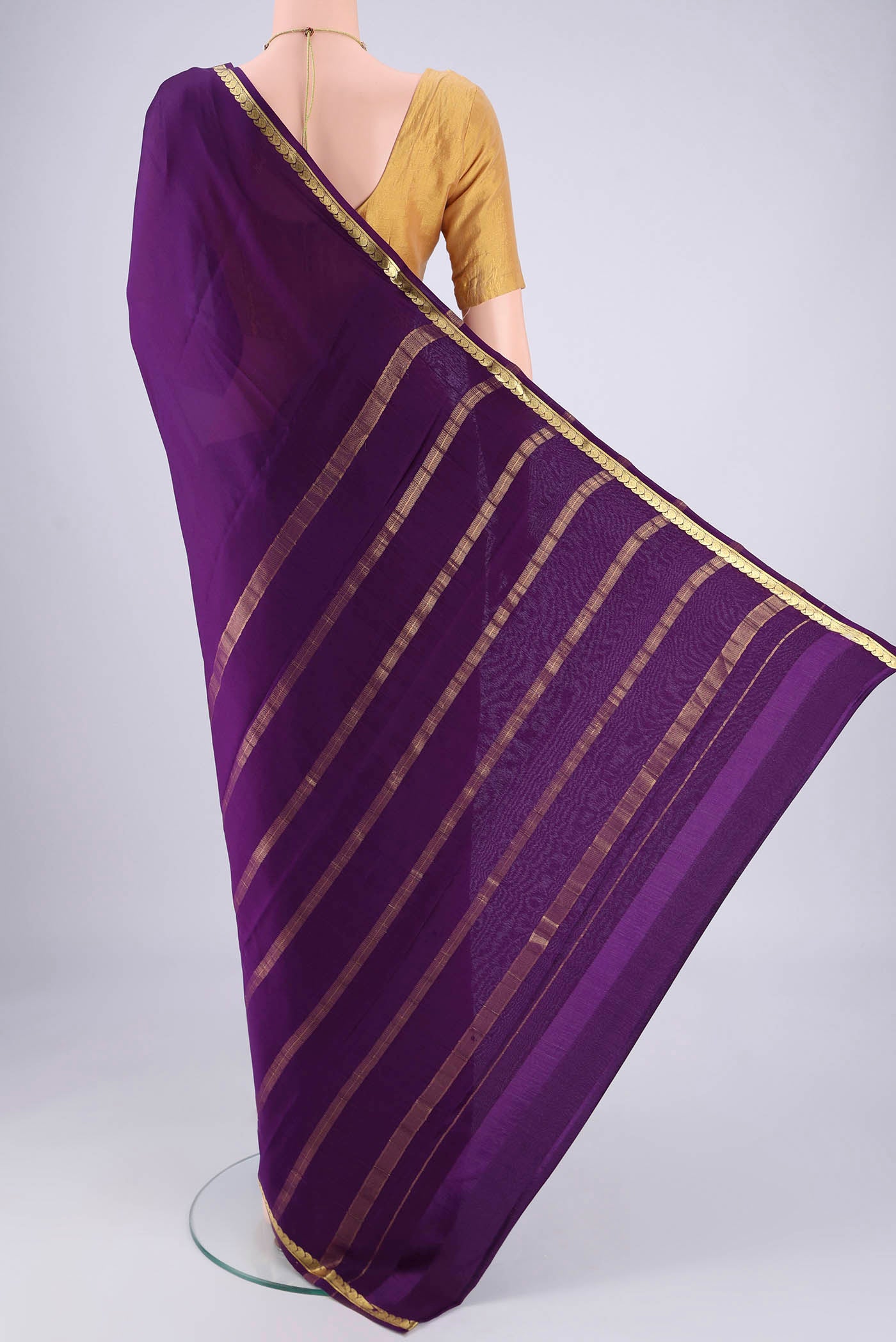 Flat view of Purple Mysore Crepe Saree with Plain Body and Zari Border. 