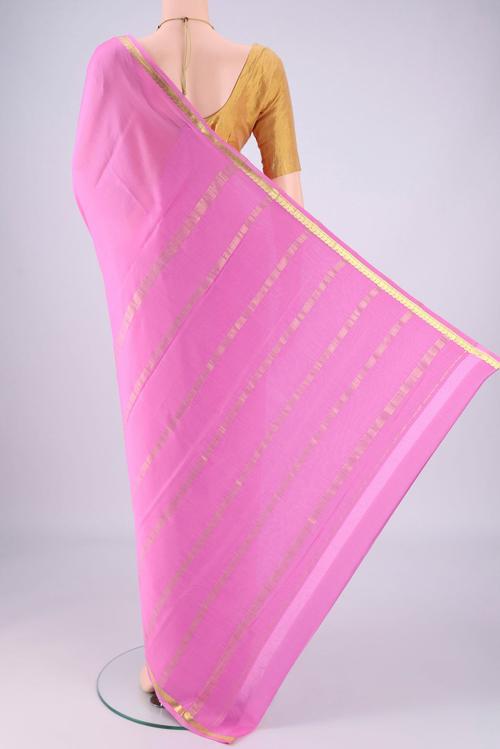 Flat view of Rose pink Mysore Crepe Saree with Plain Body and Zari Border. 