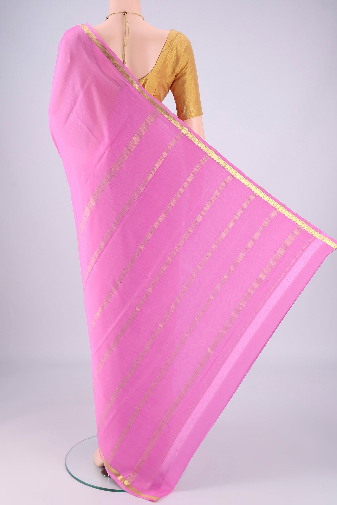 Flat view of Rose pink Mysore Crepe Saree with Plain Body and Zari Border. 