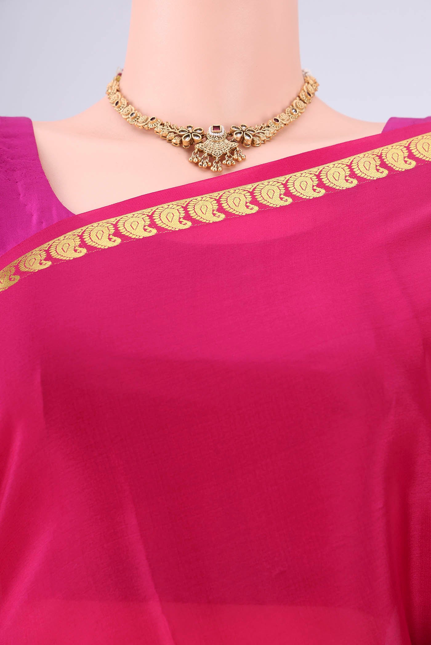 Border image of Rani Pink Mysore Crepe Saree with Plain Body and Zari Border. 