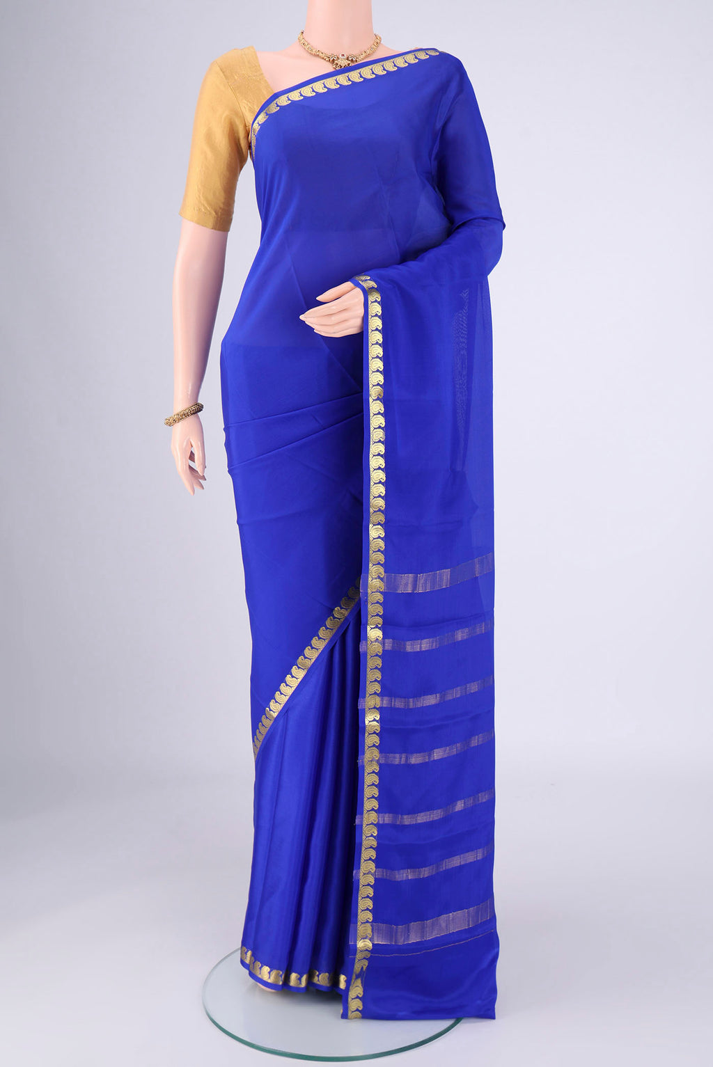 Royal Blue Mysore Crepe Saree with Plain Body and Zari Border.  displayed on a mannequin