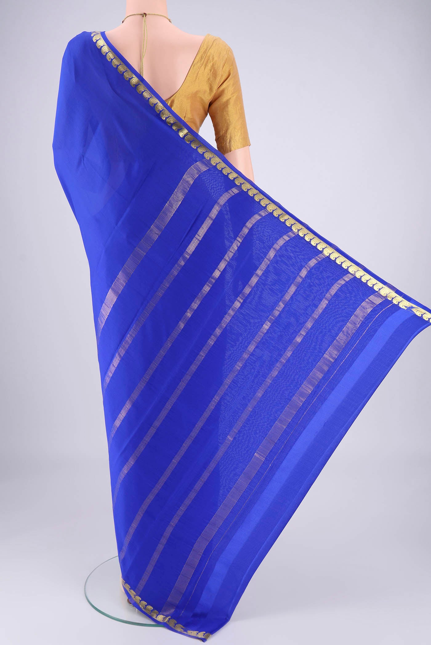 Flat view of Royal Blue Mysore Crepe Saree with Plain Body and Zari Border. 