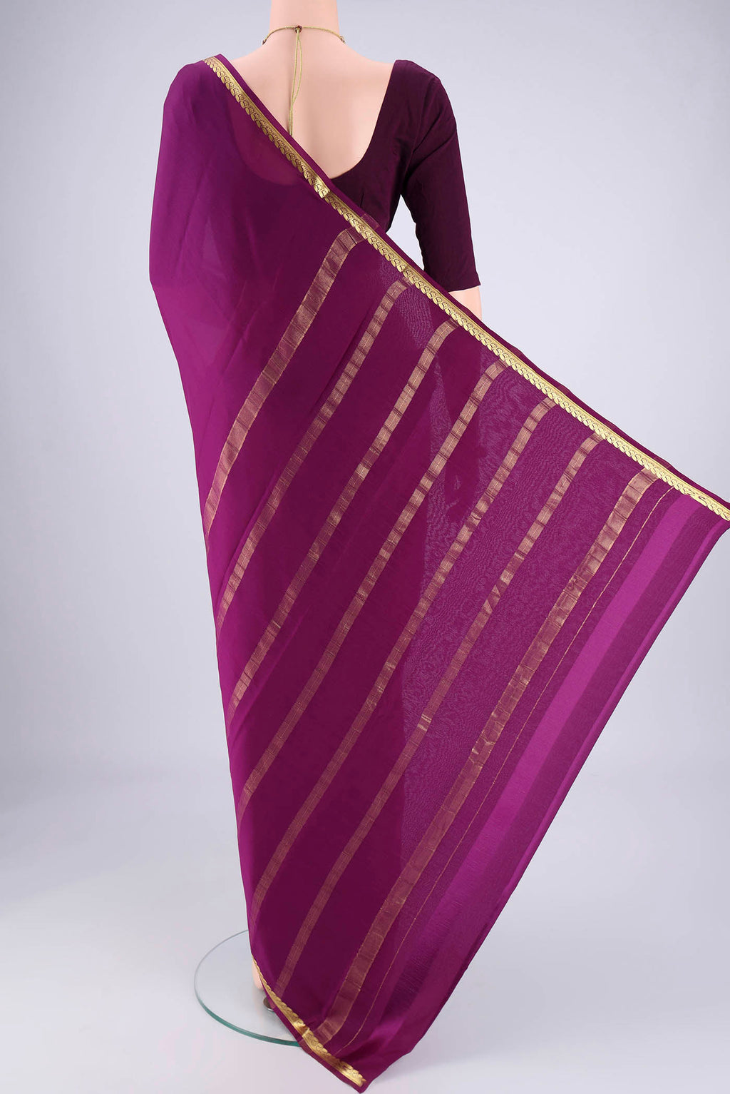 Flat view of Purple Mysore Crepe Saree with Plain Body and Zari Border. 