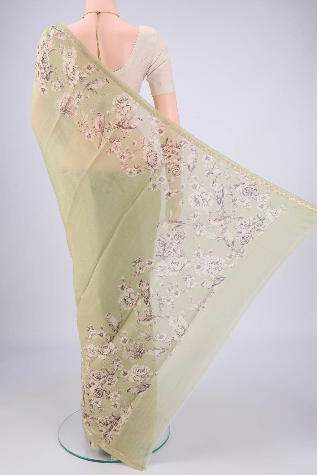 Flat view of Pista Green Chanderi Silk Cotton Saree with Floral Print on the body and Zari Border. 