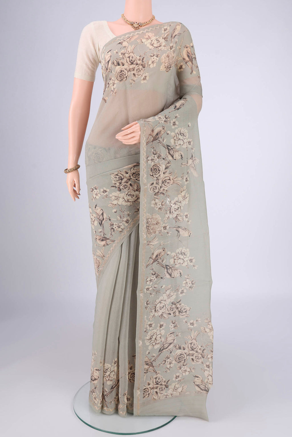 Davys Grey Chanderi Silk Cotton Saree with Floral Print on the body and Zari Border.  displayed on a mannequin